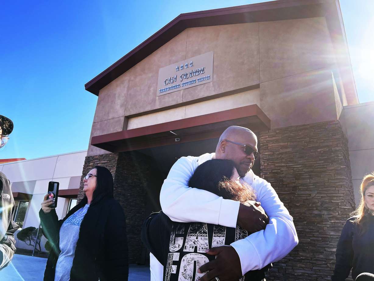 Marcus Kelley, a formerly incarcerated advocate for prisoners' rights, hugs Nina Fernandez, mother of one of the prisoners participating in the Ely State Prison hunger strike, during a rally outside the Casa Grande Transitional Housing Center in Las Vegas Friday.