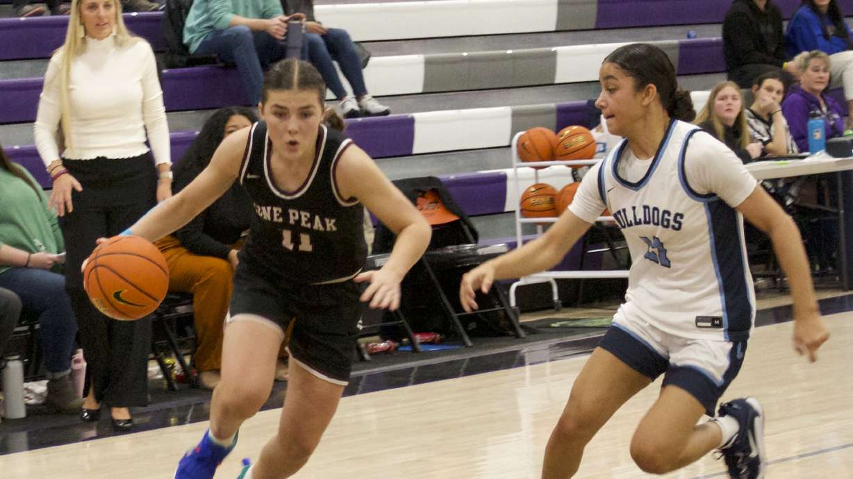 Lone Peak's Kailey Woolston drives to the rim against Centennial as the No. 15 Knights face No. 23 Centennial (Nev.) at Holiday Hoopfest at Lehi High School, Friday, Dec. 9, 2022 in Lehi.