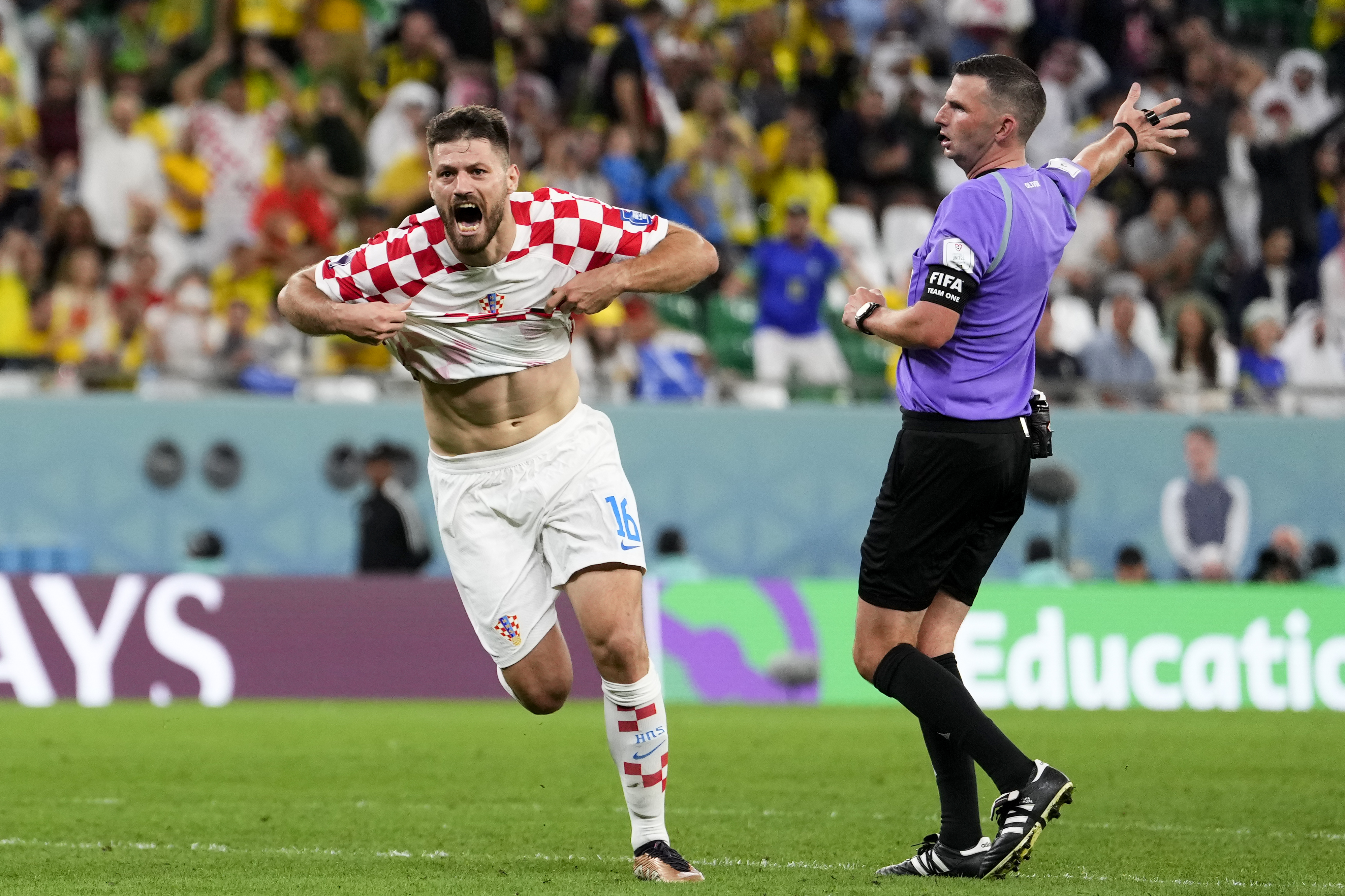 Croatia's Bruno Petkovic celebrates scoring his side's opening goal during the World Cup quarterfinal soccer match between Croatia and Brazil, at the Education City Stadium in Al Rayyan, Qatar, Friday, Dec. 9, 2022. 