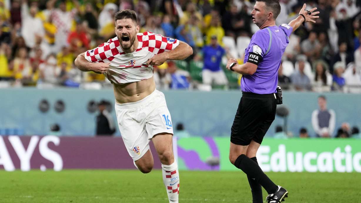 Croatia's Bruno Petkovic celebrates scoring his side's opening goal during the World Cup quarterfinal soccer match between Croatia and Brazil, at the Education City Stadium in Al Rayyan, Qatar, Friday, Dec. 9, 2022.