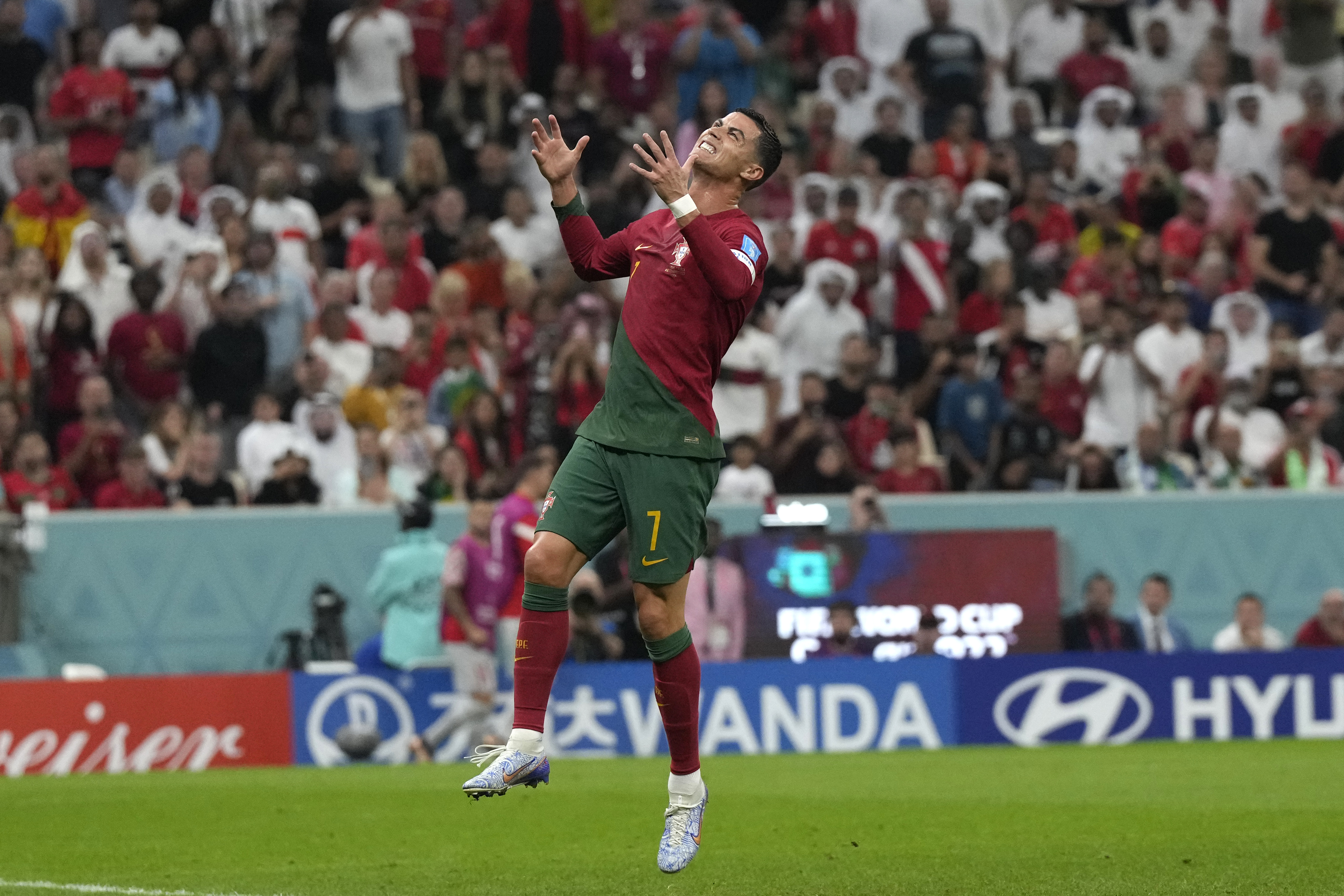 Portugal's Cristiano Ronaldo reacts after missing a scoring chance during the World Cup round of 16 soccer match between Portugal and Switzerland, at the Lusail Stadium in Lusail, Qatar, Tuesday, Dec. 6, 2022.