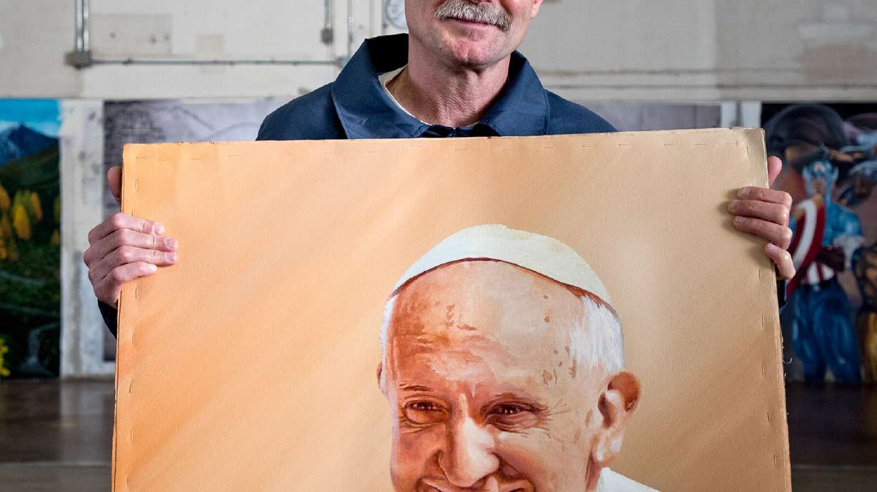 One of photographer Peter Merts' subjects with an acrylic painting of Pope Francis in 2016. The man was released from prison three years later and now owns a property where he builds micro-homes for homeless people and those who have been released from prison.