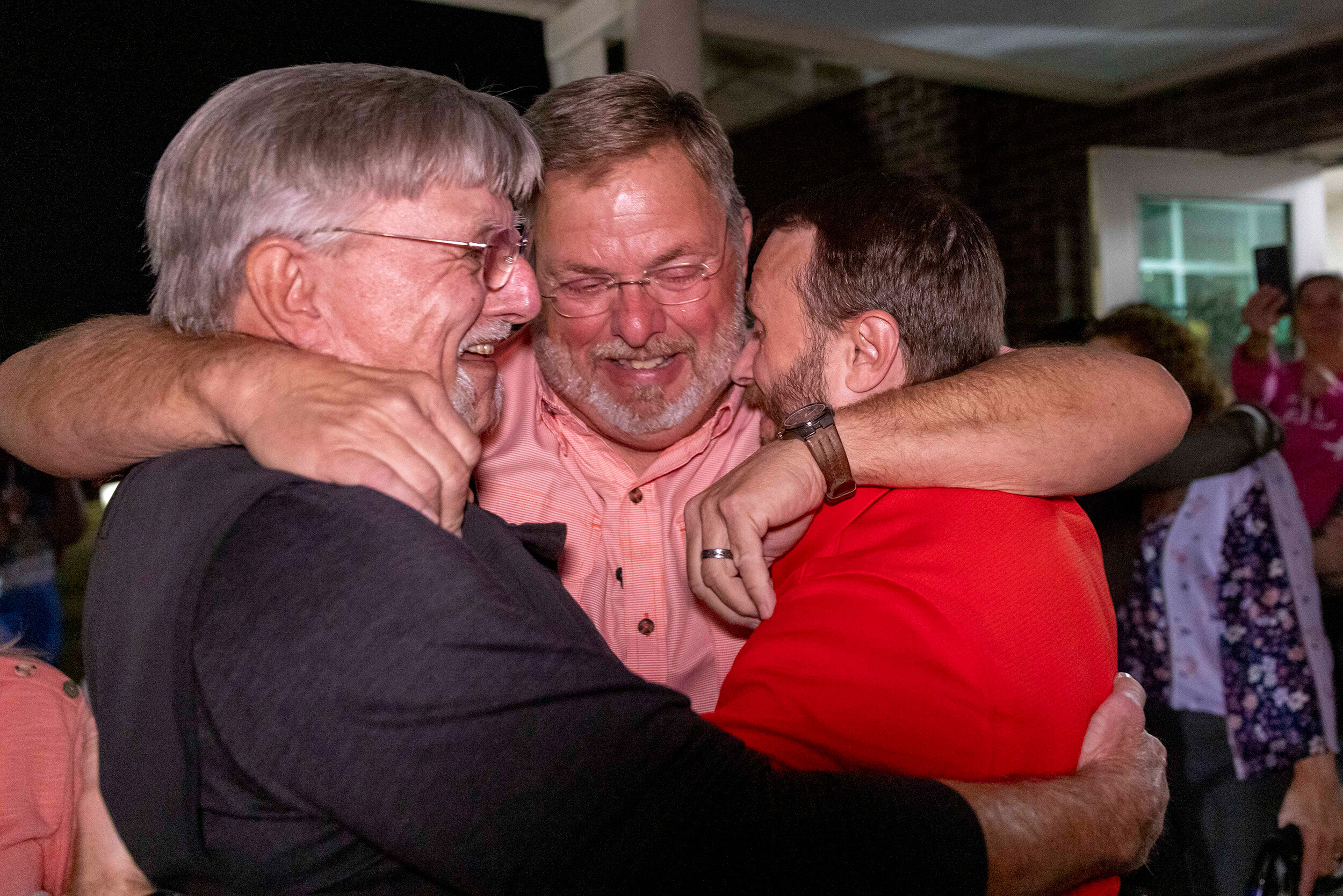 Lee Clark, right, embraces family and friends immediately after his release from Floyd County Jail. He and another Georgia man were exonerated of murder after spending 25 years in prison.