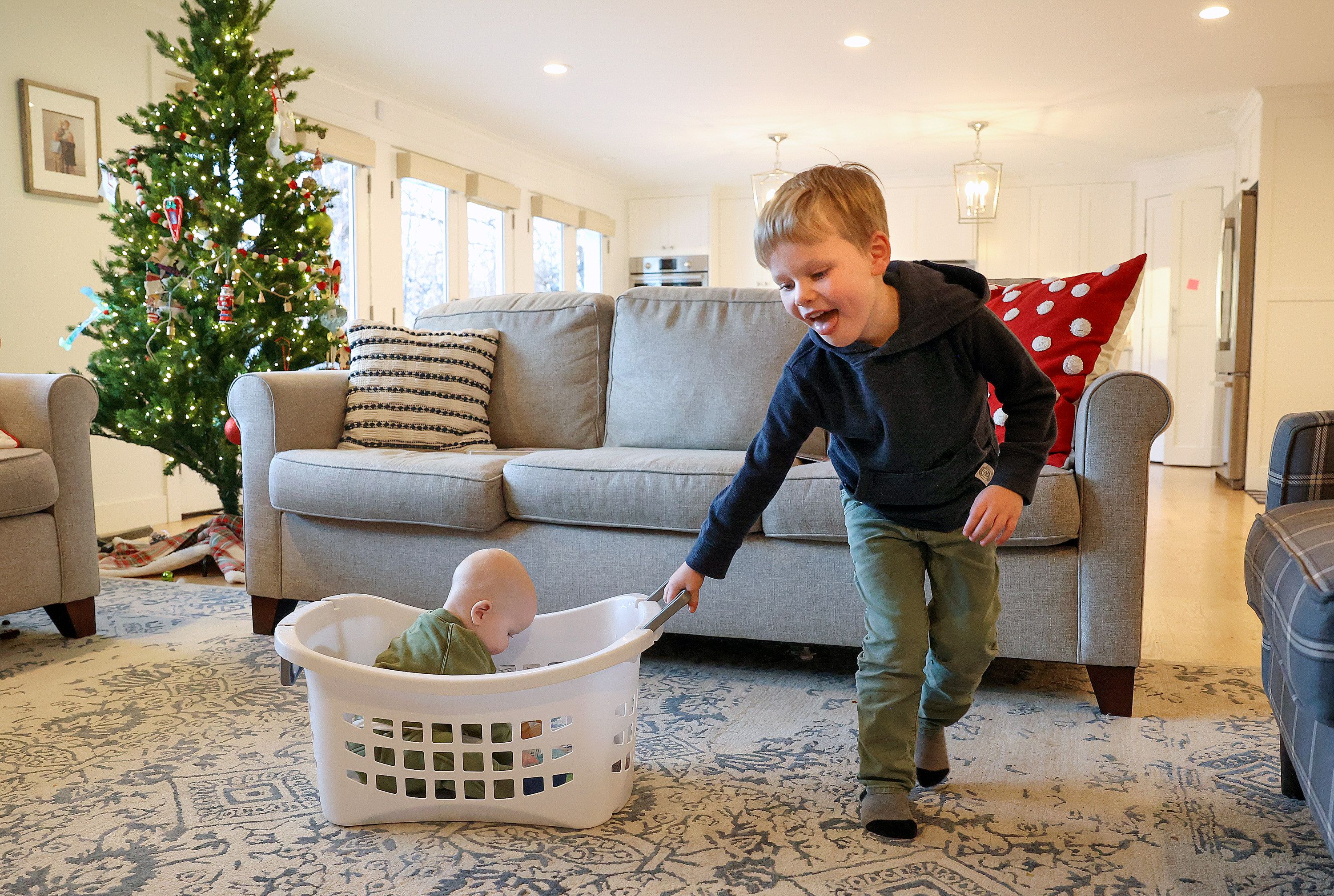 Matthew Lowe, 5, who was hospitalized with RSV, plays with his brother Scotty at home in Salt Lake City on Friday. Utahns may see more reinfections in the coming months.
