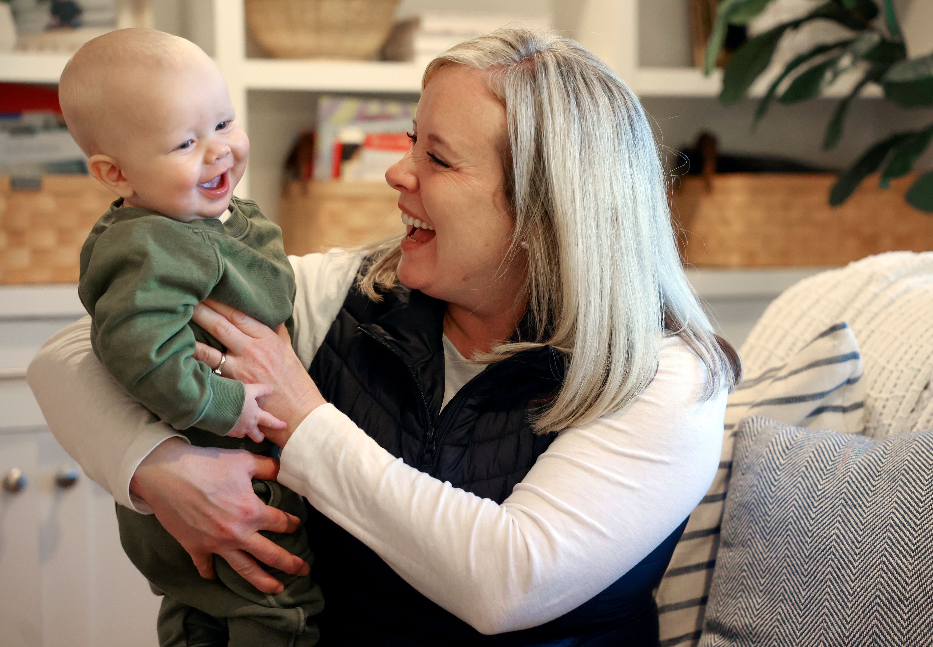 Michelle Lowe plays with her son Scotty at home in Salt Lake City on Friday, Dec. 9, 2022. Her other son Matthew Lowe, five, was hospitalized with RSV in November.