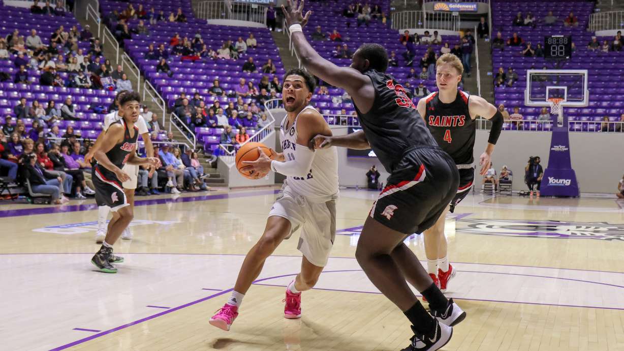 Weber State guard Steven Verplancken (11) drives into the lane in the Wildcats' 82-58 win against Division II Saint Martin's on Dec. 10, 2022.
