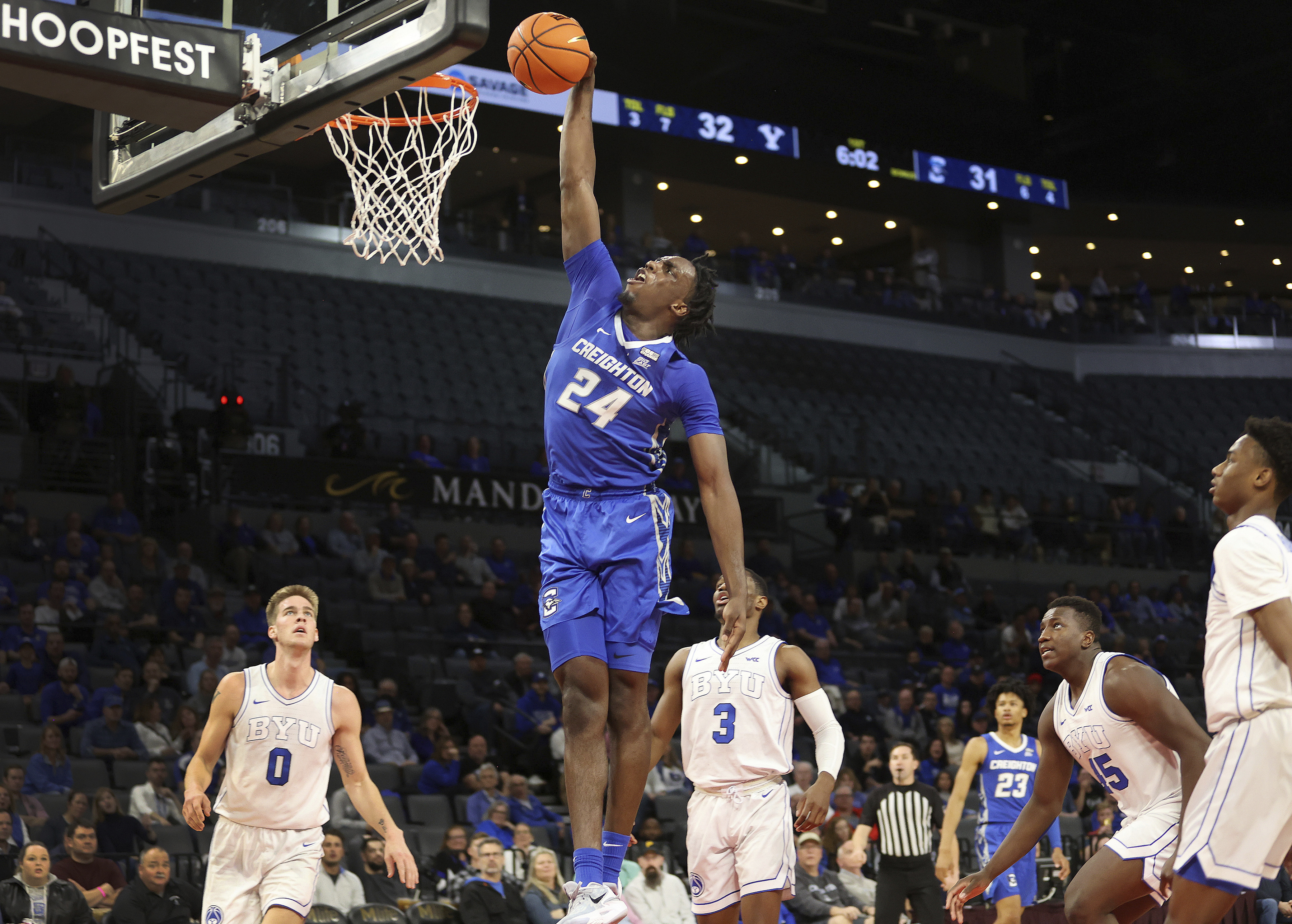 Creighton forward Arthur Kaluma (24) goes up for a dunk against BYU during the first half of an NCAA college basketball game Saturday, Dec. 10, 2022, in Las Vegas.