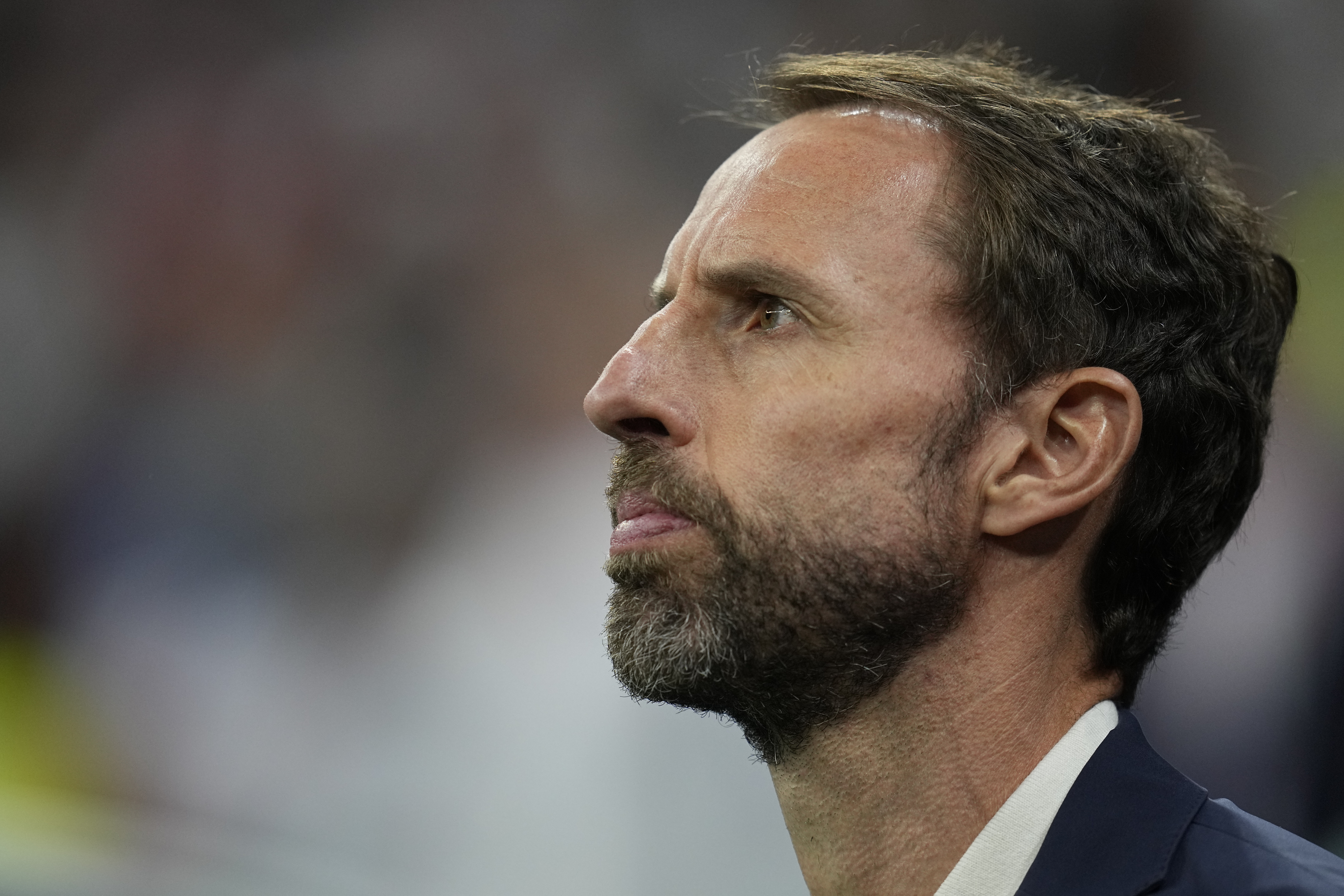 England's head coach Gareth Southgate stands during his national anthem prior to the World Cup quarterfinal soccer match between England and France, at the Al Bayt Stadium in Al Khor, Qatar, Saturday, Dec. 10, 2022.