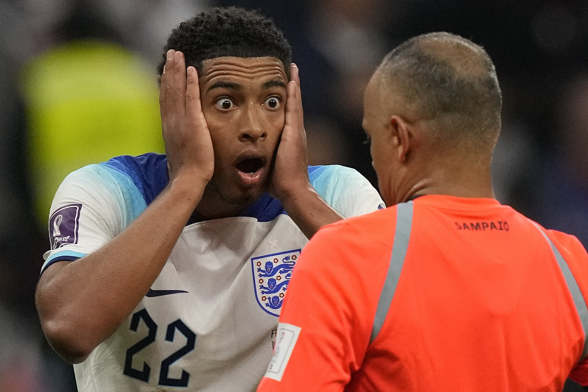 England's Jude Bellingham reacts in front of referee Wilton Sampaio during the World Cup quarterfinal soccer match between England and France, at the Al Bayt Stadium in Al Khor, Qatar, Saturday, Dec. 10, 2022. 