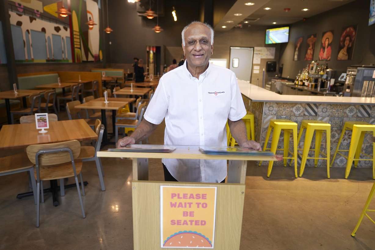 Mani Bhushan, owner of Taco Ocho, poses at one of his restaurants in McKinney, Texas on Friday, November 11. Bhushan is struggling to hire workers at the McKinney site, which opened in July 2021. He said many workers cannot afford to live in this upscale suburb and have to travel from elsewhere.