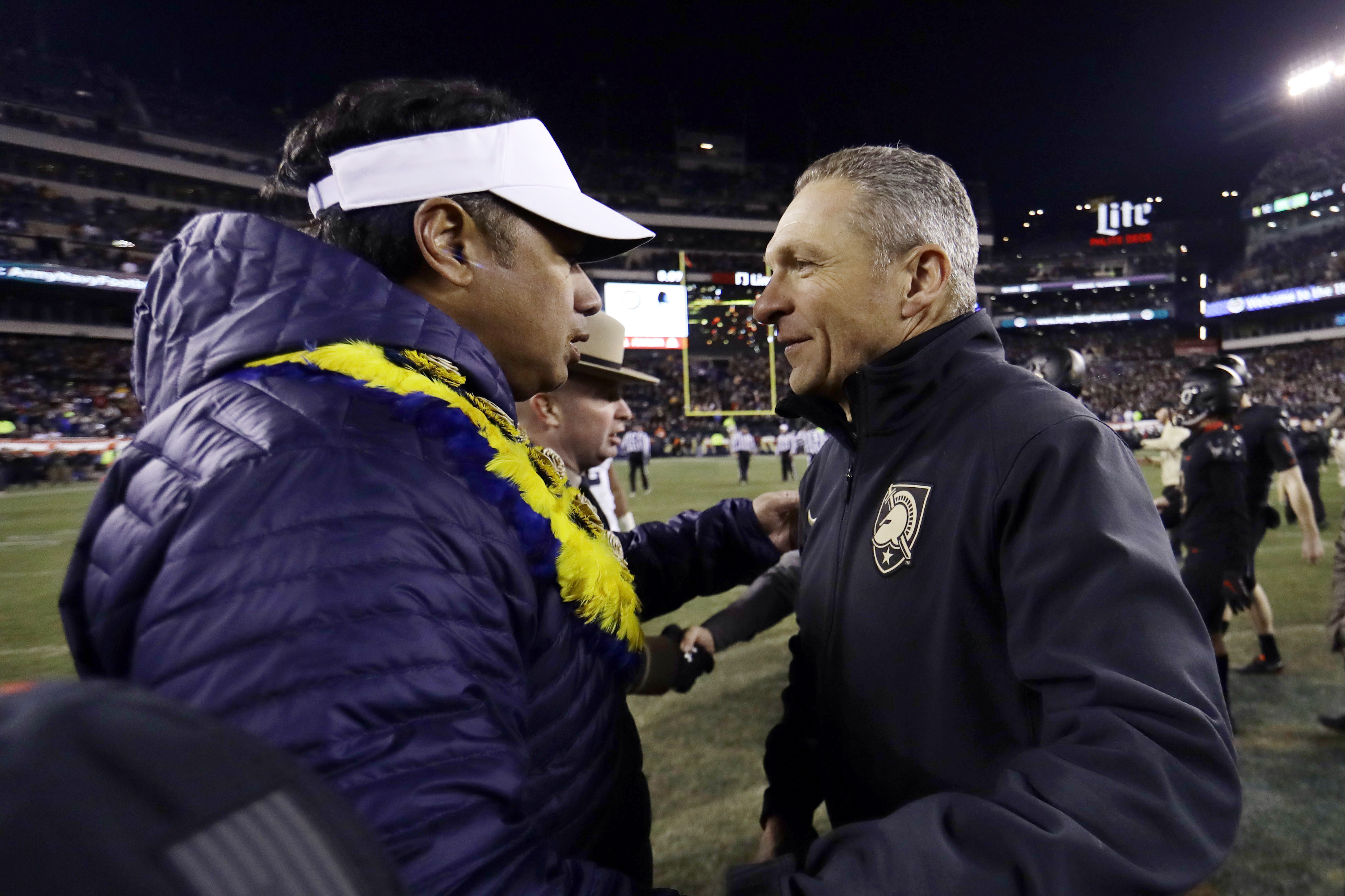 FILE - In this Dec. 8, 2018, file photo, Army head coach Jeff Monken, right, greets Navy head coach Ken Niumatalolo after an NCAA college football game in Philadelphia. Army and Navy play on Saturday, Dec. 10, 2022, for the 123rd time, the 90th time in Philadelphia and 14th time at Lincoln Financial Field, the home of the NFL-leading Philadelphia Eagles. 