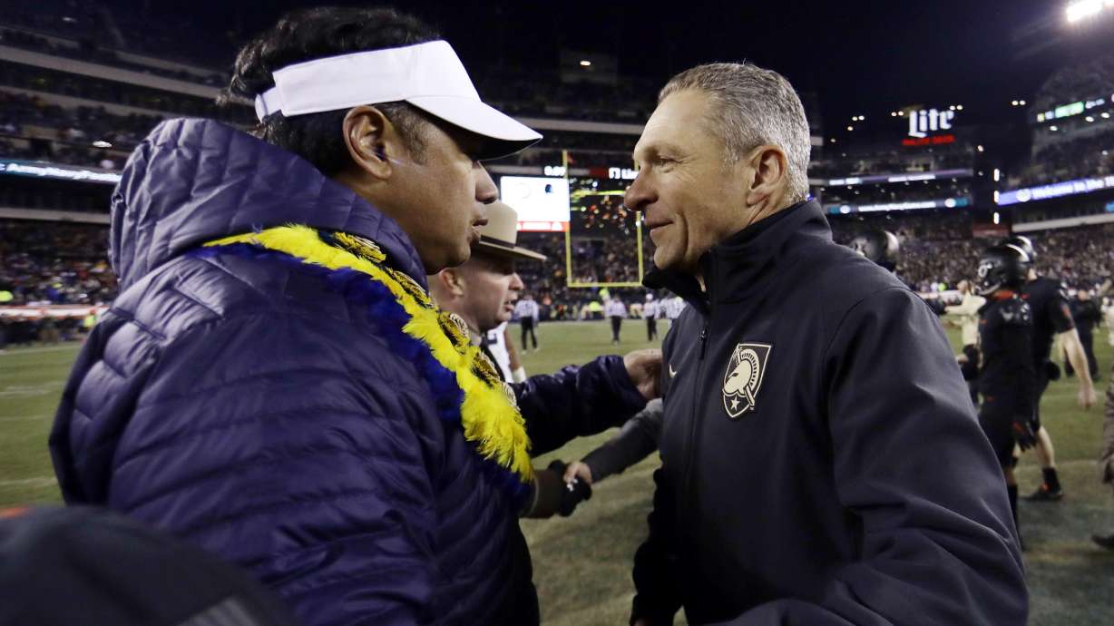 FILE - In this Dec. 8, 2018, file photo, Army head coach Jeff Monken, right, greets Navy head coach Ken Niumatalolo after an NCAA college football game in Philadelphia. Army and Navy play on Saturday, Dec. 10, 2022, for the 123rd time, the 90th time in Philadelphia and 14th time at Lincoln Financial Field, the home of the NFL-leading Philadelphia Eagles.