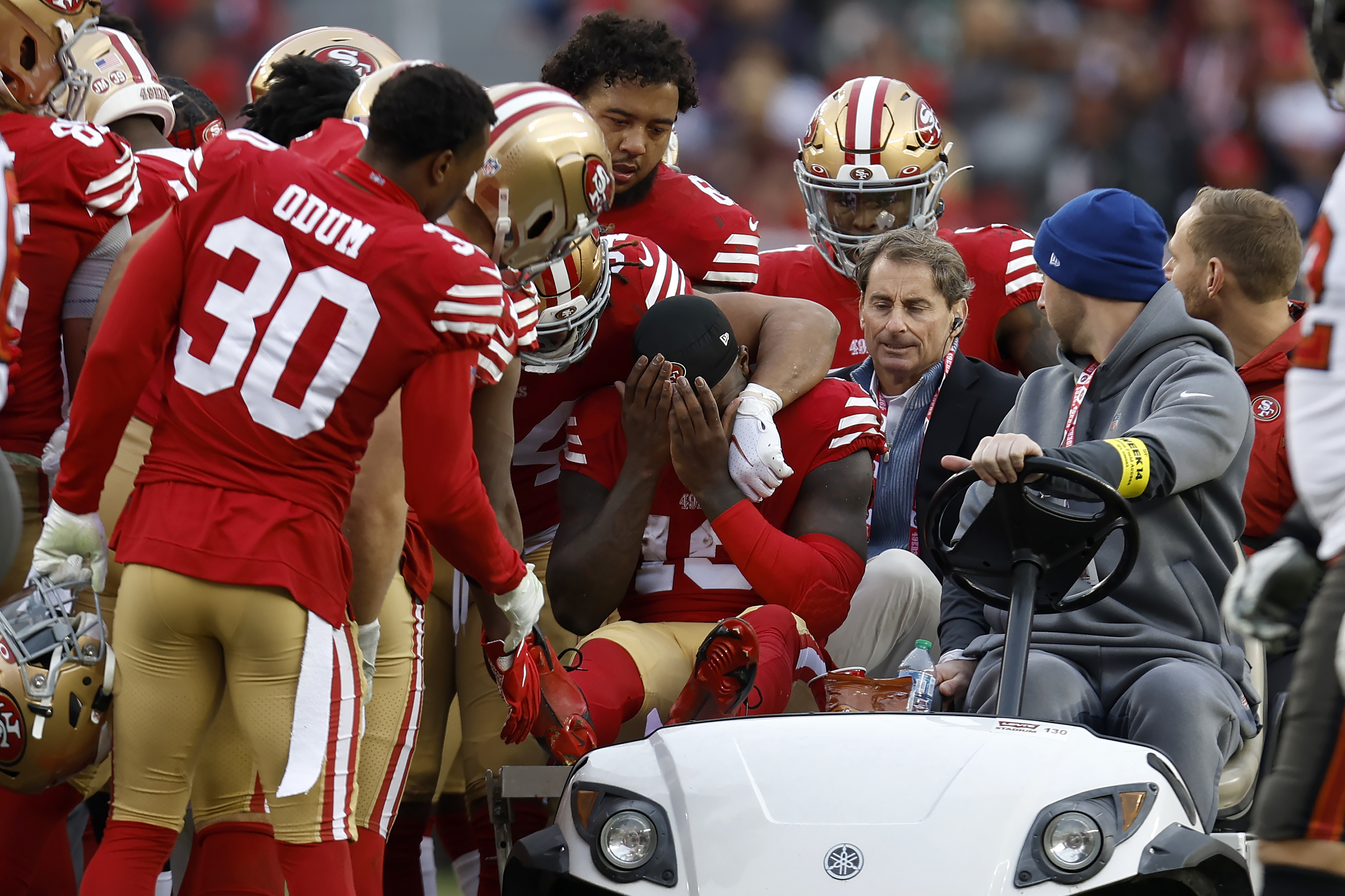 San Francisco 49ers wide receiver Deebo Samuel, middle, reacts as he is carted off the field during the first half of an NFL football game against the Tampa Bay Buccaneers in Santa Clara, Calif., Sunday, Dec. 11, 2022.