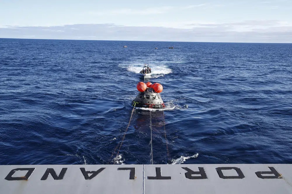 NASA's Orion capsule makes its way toward the U.S.S. Portland after being successfully secured by a NASA and U.S. Navy team in the Pacific off Mexico, Sunday concluding a 25-day test flight. The mission should clear the way for astronauts on the program’s next lunar flyby, set for 2024.