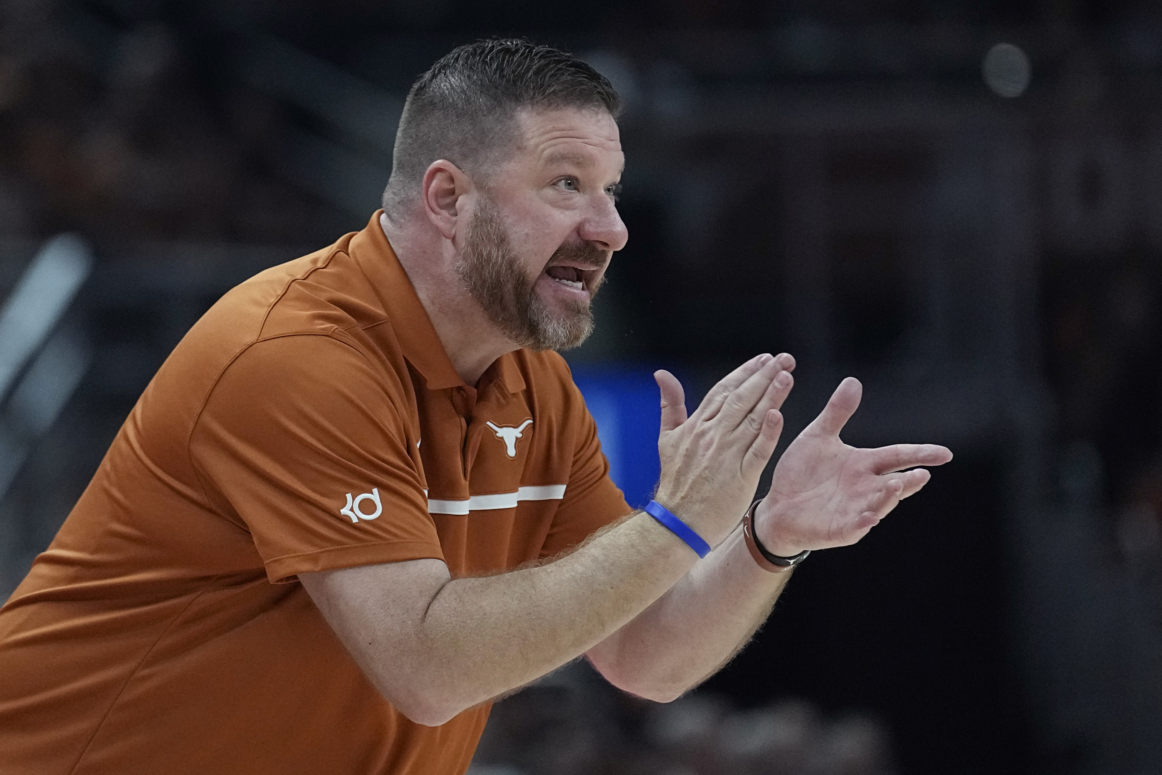 Texas head coach Chris Beard talks to his players during the first half of an NCAA college basketball game against Arkansas-Pine Bluff in Austin, Texas, Saturday, Dec. 10, 2022.