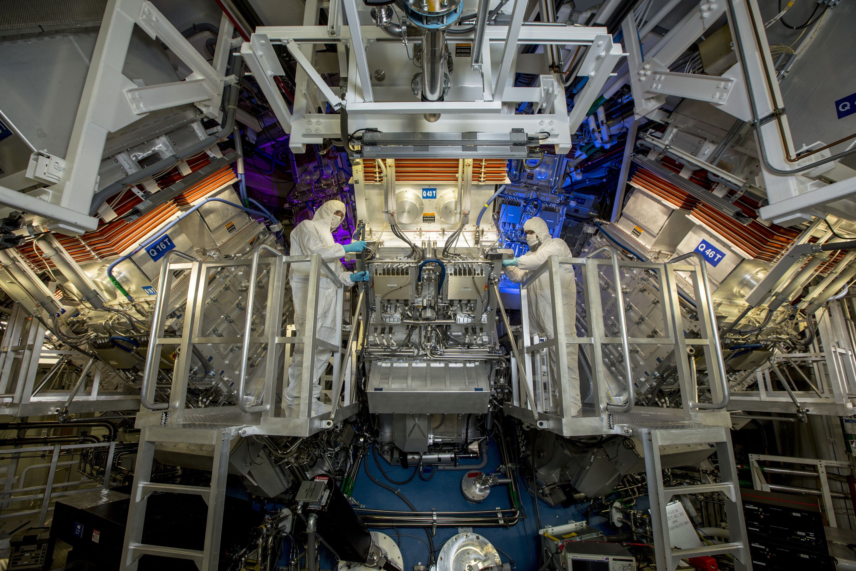 People work at the Lawrence Livermore National Laboratory’s National Ignition Facility in California. The facility is working to develop nuclear fusion energy.