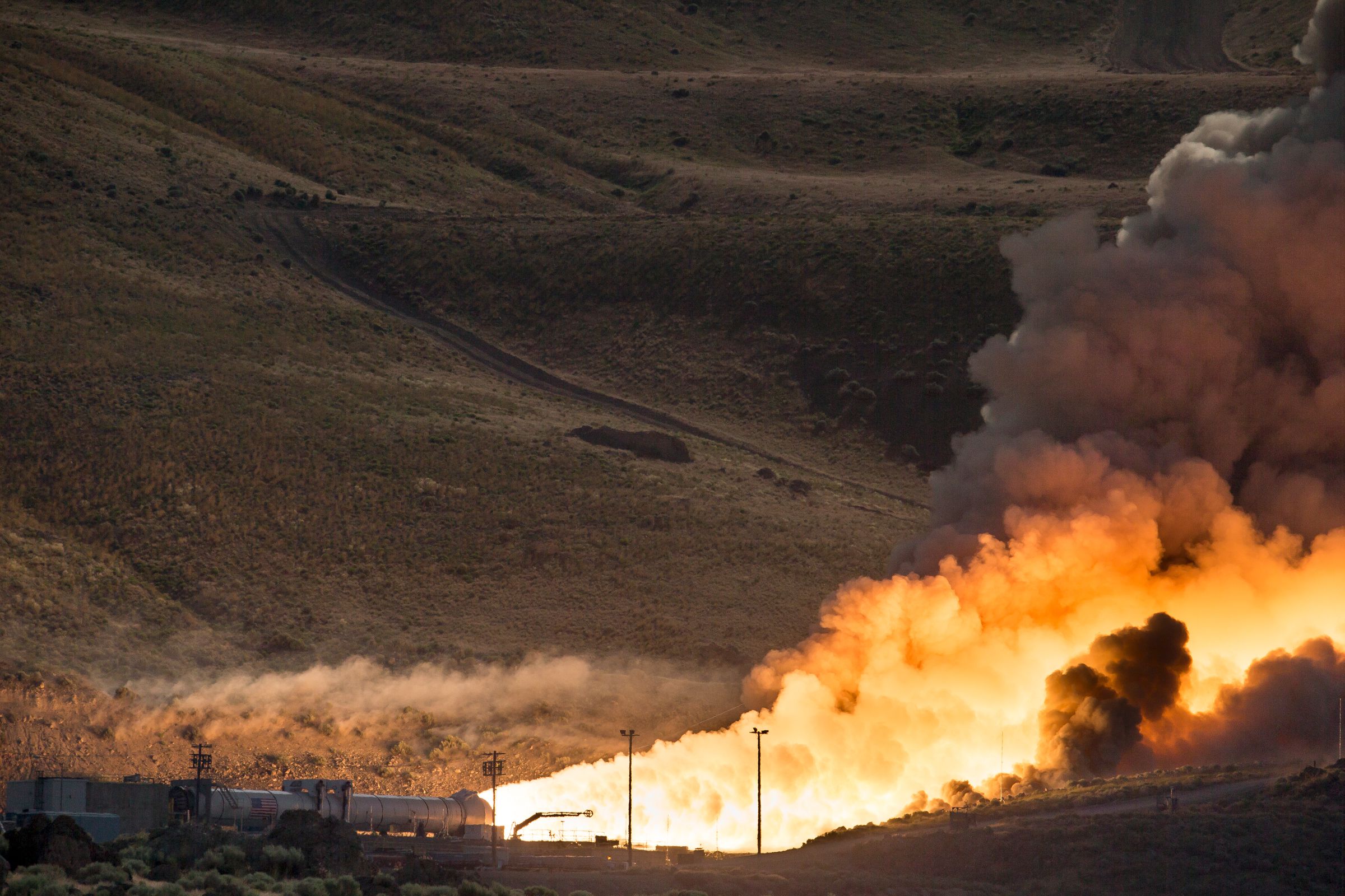 The five-segment rocket motor that will be used for NASA’s heavy-lift Space Launch System undergoes a ground test at the Orbital ATK facility in Promontory on June 28, 2016.