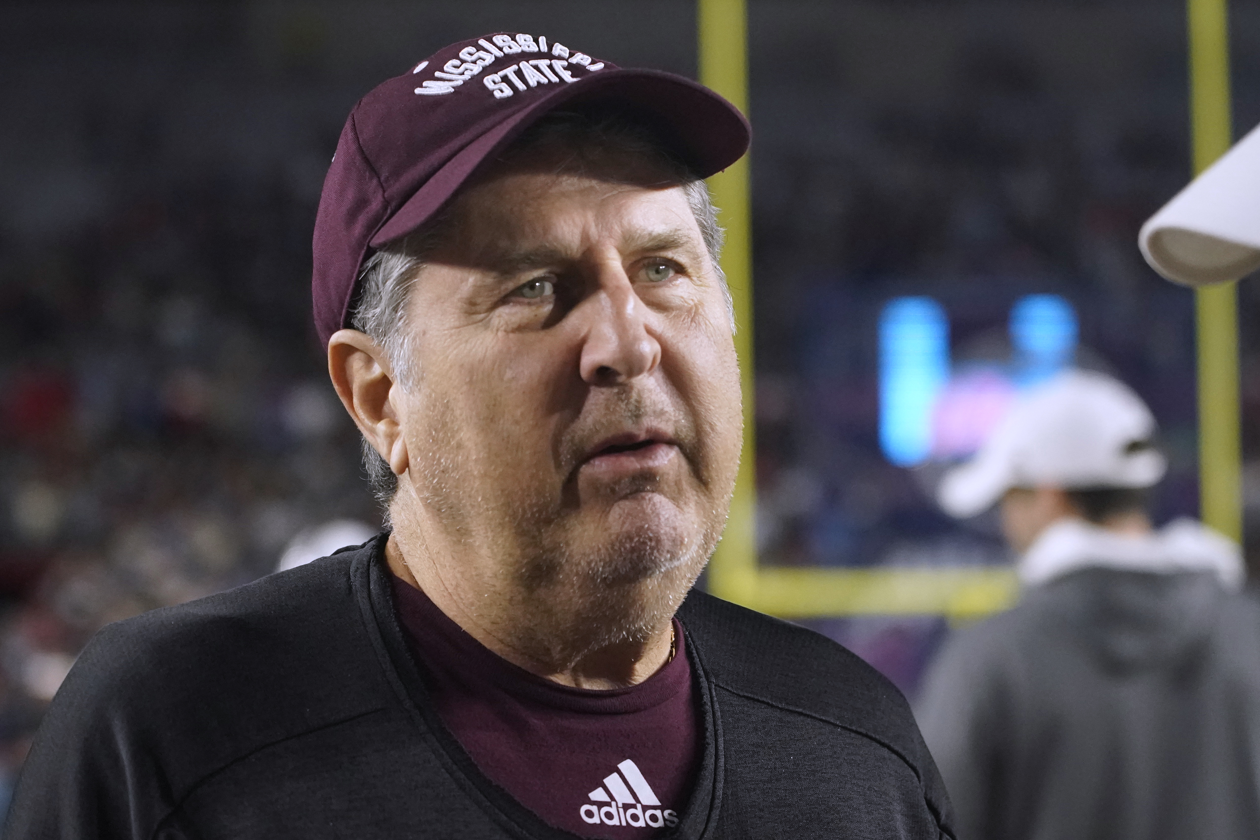 Mississippi State coach Mike Leach talks with Mississippi coach Lane Kiffin before an NCAA college football game in Oxford, Miss., Nov. 24. Leach has died following complications from a heart condition at the age of 61. 