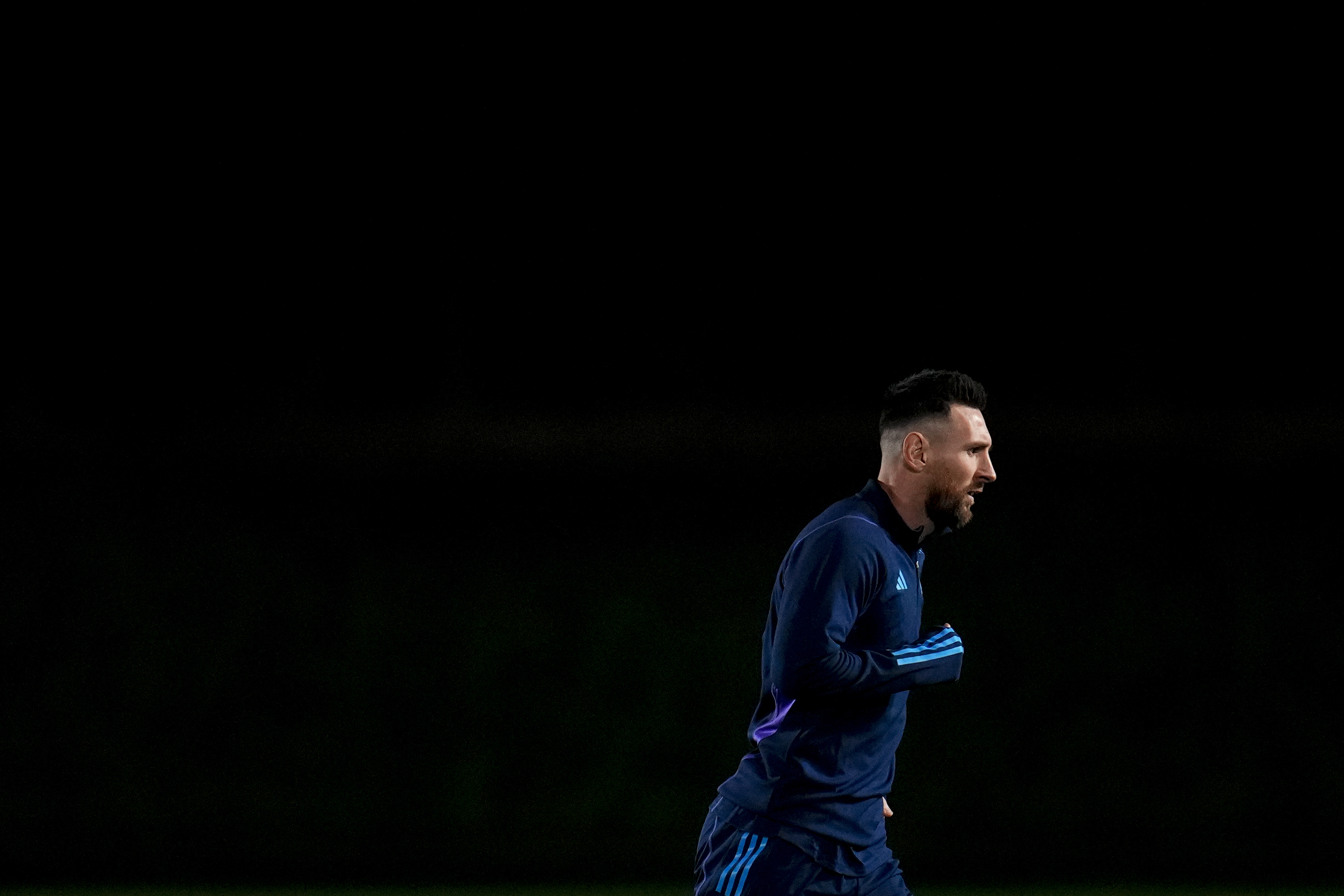 Argentina's Lionel Messi warms up during a training session ahead of the semifinal soccer match between Argentina and Croatia in Doha, Qatar, Monday, Dec. 12, 2022. 