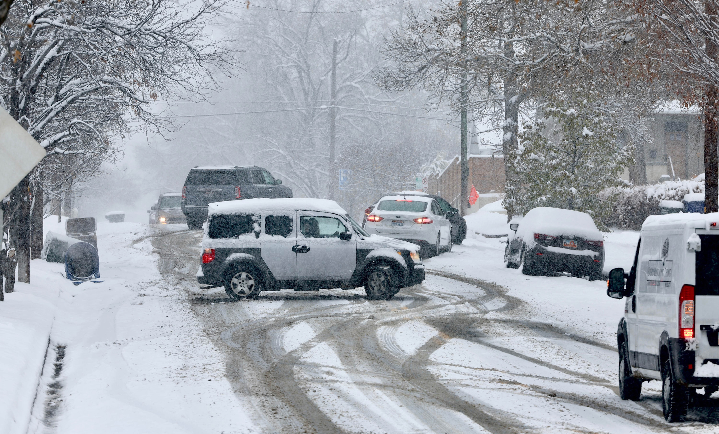 Drivers struggle to negotiate the roads in Salt Lake City's Avenues neighborhood Tuesday morning.