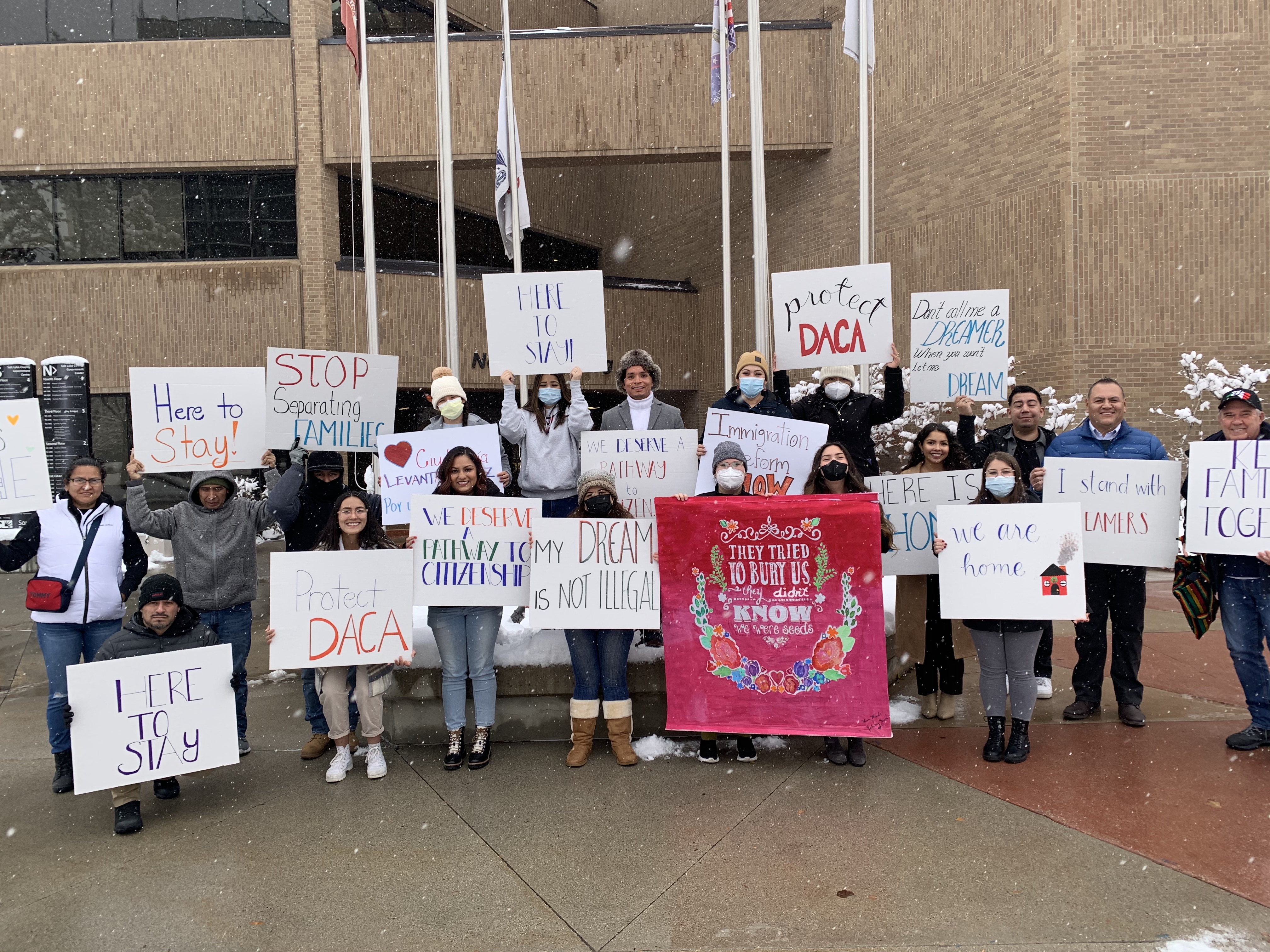 Comunidades Unidas and other community members pose for a photo after an event to call on Utah Sen. Mitt Romney to protect the Deferred Action for Childhood Arrivals program.