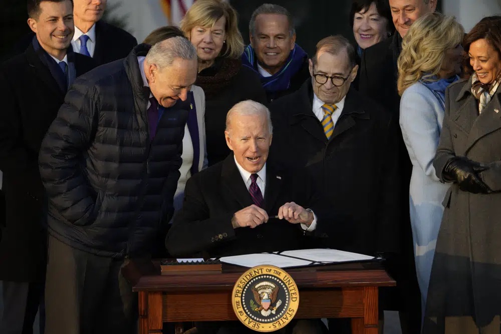 President Joe Biden signs the Respect for Marriage Act, Tuesday, on the South Lawn of the White House in Washington.