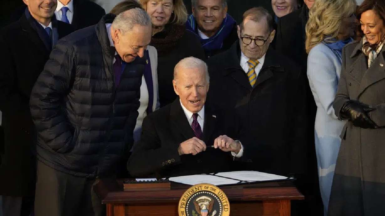 President Joe Biden signs the Respect for Marriage Act, Tuesday, on the South Lawn of the White House in Washington.
