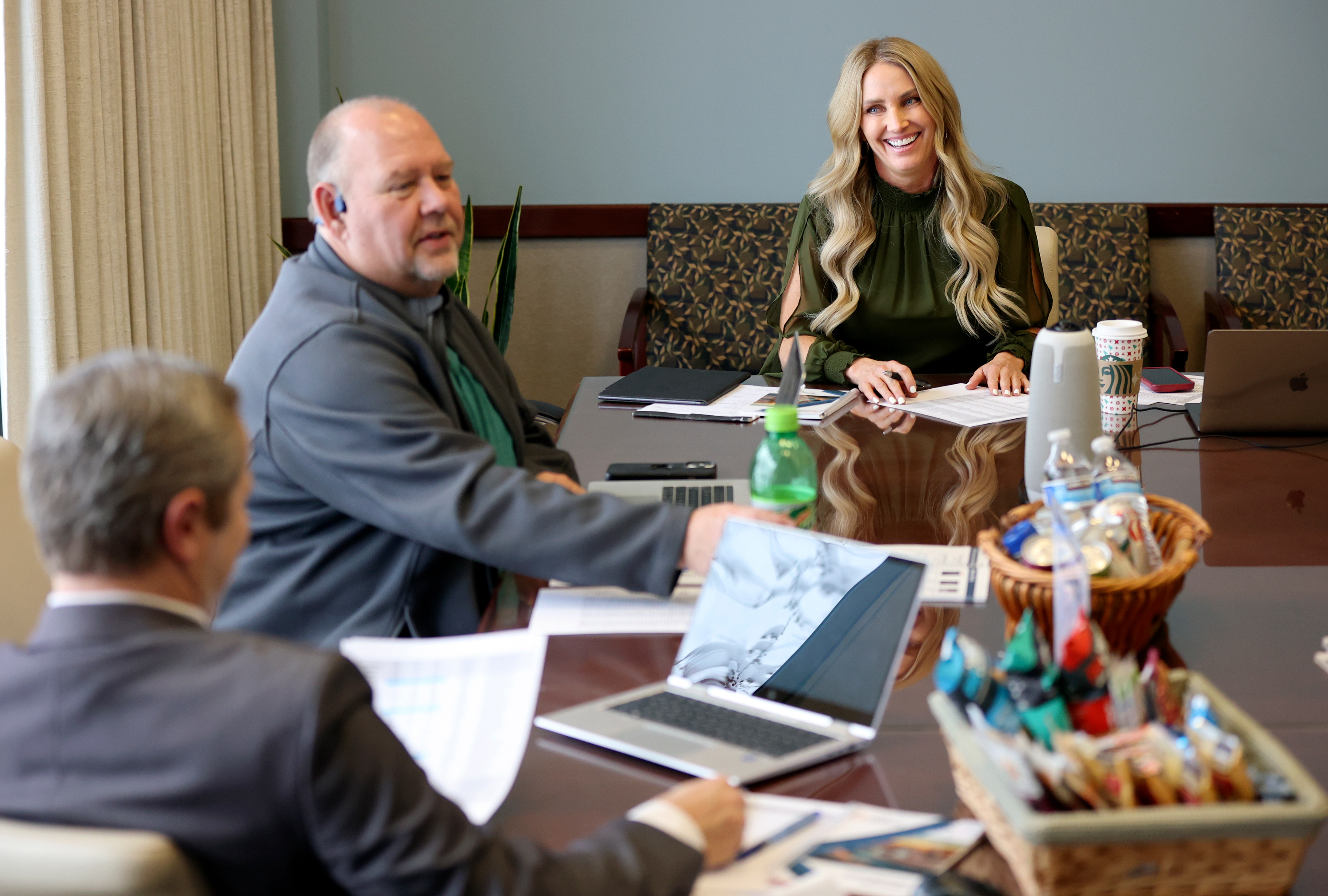 Brandy Grace, Utah Association of Counties CEO, leads an executive committee meeting at the Utah Association of Counties in Murray on Tuesday. Also pictured are Darin Bushman, Piute County commissioner, center, and Curtis Koch, Davis County auditor, left.