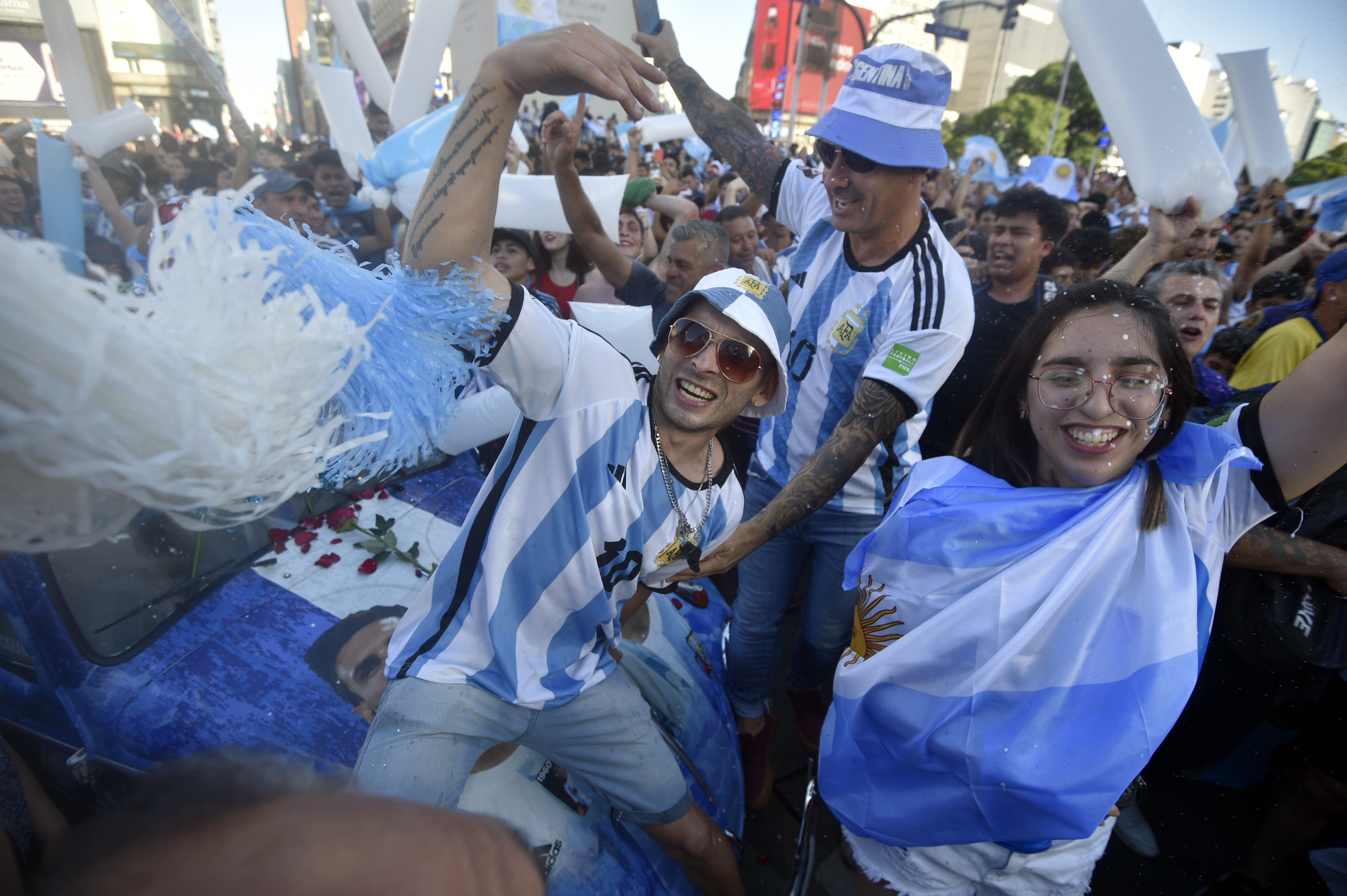 Argentina soccer fans celebrate their team's victory over Croatia at the end of the team's World Cup semifinal match in Qatar after watching it on TV in Buenos Aires, Argentina, Tuesday, Dec. 13, 2022. 