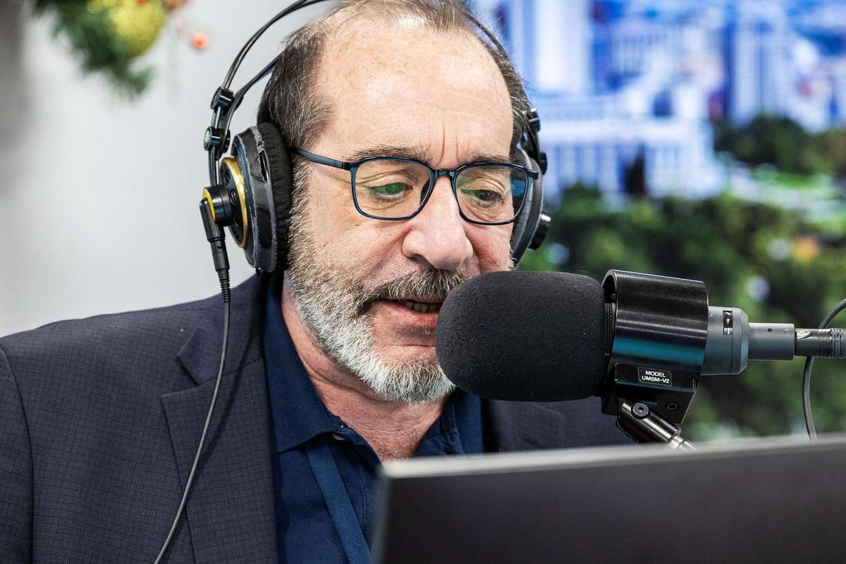 Jeff Caplan of KSL News Radio does his broadcast from the Triad Center in Salt Lake City on Dec. 6.