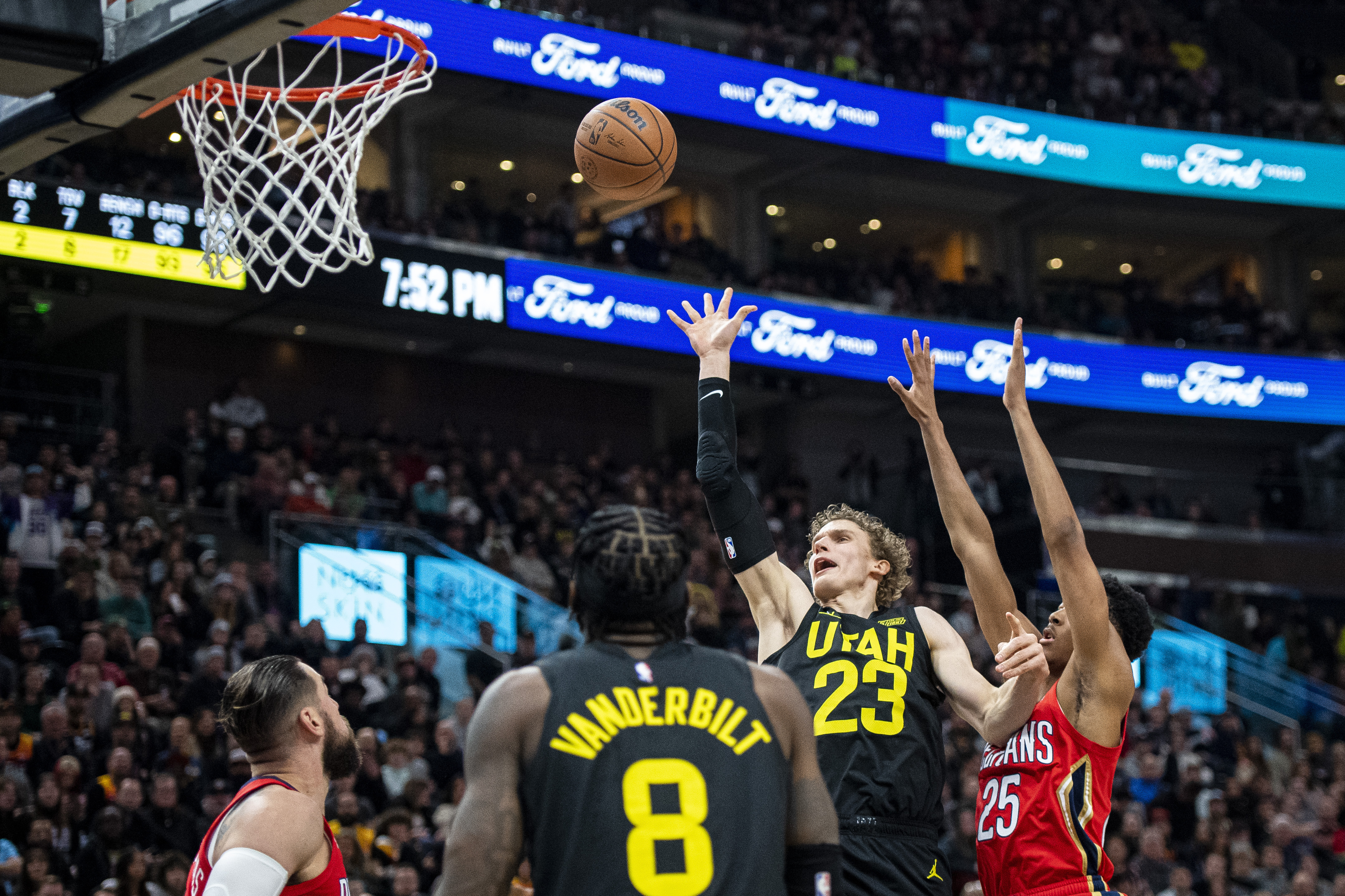 Utah Jazz forward Lauri Markkanen (23) lays the ball up while contested by New Orleans Pelicans guard Trey Murphy III (25) in the first half during an NBA basketball game Tuesday, Dec. 13, 2022, in Salt Lake City. 