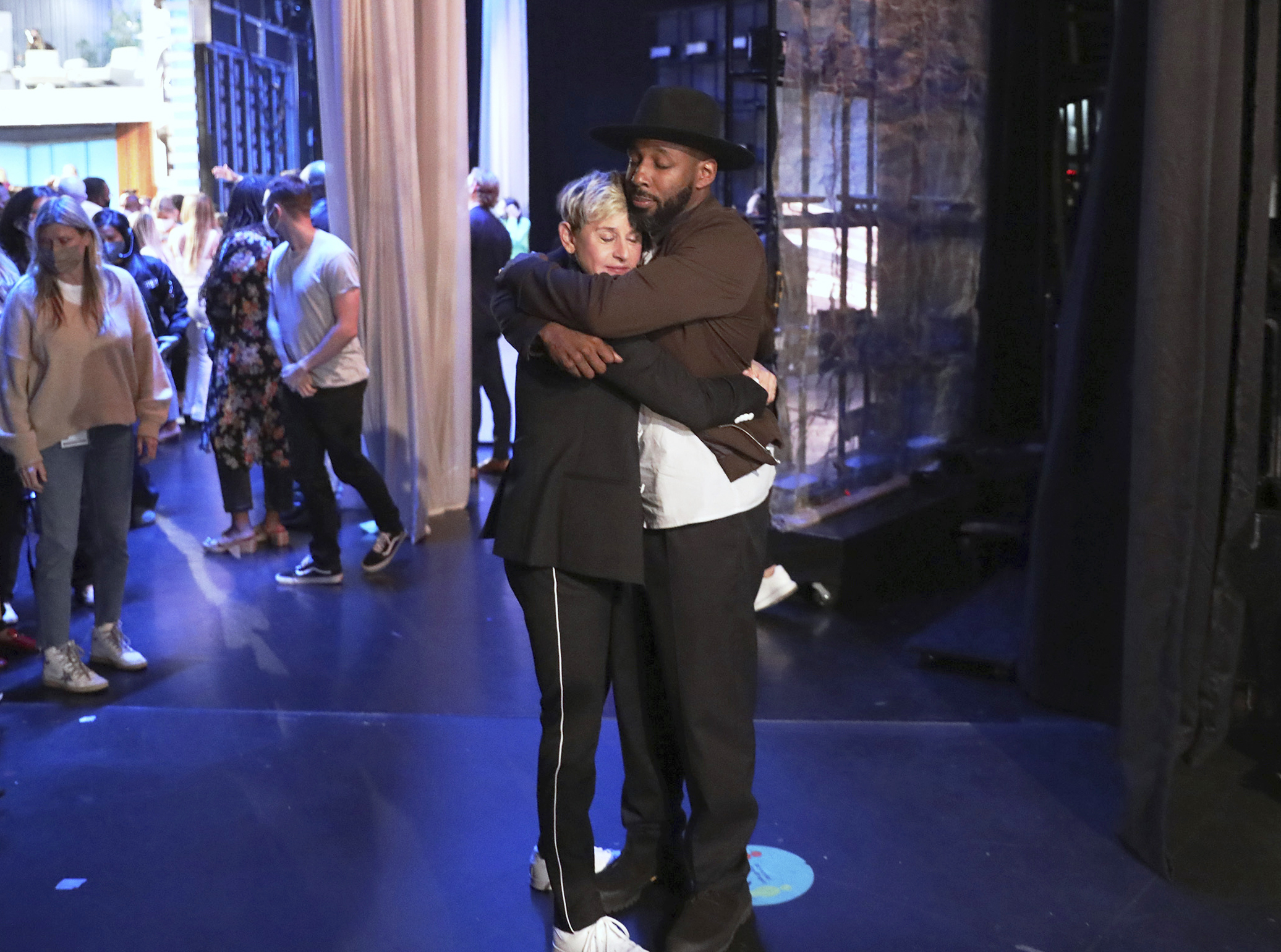 In this photo released by Warner Bros., talk show host Ellen DeGeneres embraces Stephen "tWitch" Boss during a taping of "The Ellen DeGeneres Show" at the Warner Bros. lot in Burbank, Calif. Boss, a longtime DJ and co-executive producer on the talk show “The Ellen DeGeneres Show” and former contestant on the dance competition show, “So You Can Think You Can Dance” has died at the age of 40.