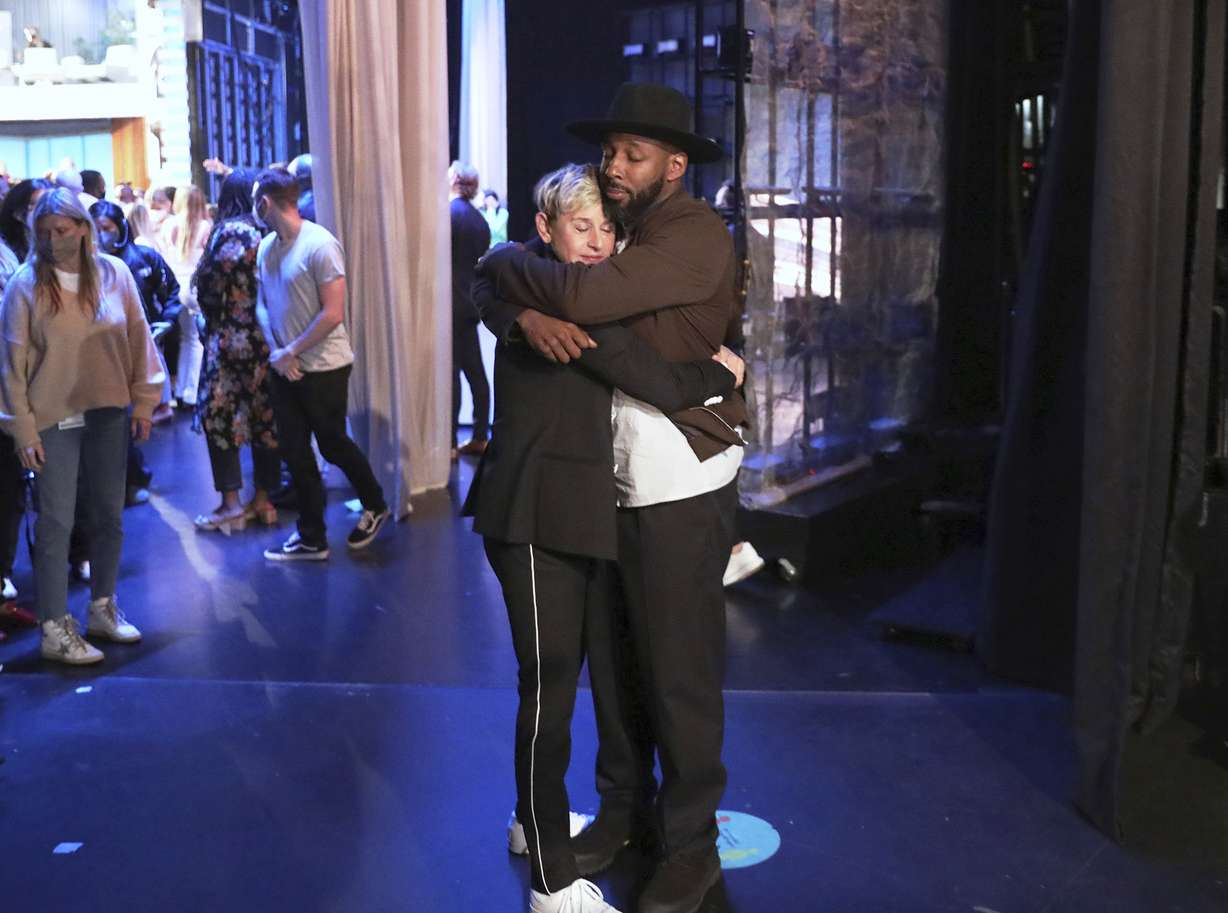 In this photo released by Warner Bros., talk show host Ellen DeGeneres embraces Stephen "tWitch" Boss during a taping of "The Ellen DeGeneres Show" at the Warner Bros. lot in Burbank, Calif. Boss, a longtime DJ and co-executive producer on the talk show “The Ellen DeGeneres Show” and former contestant on the dance competition show, “So You Can Think You Can Dance” has died at the age of 40.