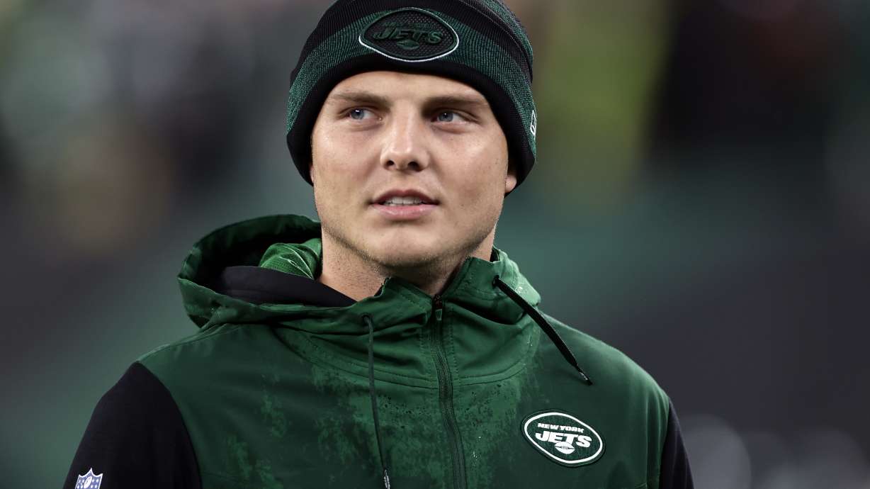 New York Jets quarterback Zach Wilson (2) reacts against the Chicago Bears during an NFL football game, Nov. 27, 2022, in East Rutherford, N.J. Wilson is moving up on the New York Jets' quarterback depth chart this week. Coach Robert Saleh announced Wednesday, Dec. 14, 2022 the benched former starter is being promoted from No. 3 to the backup behind current starter Mike White, who's dealing with a rib injury but is expected to make his fourth straight start Sunday against the Detroit Lions.