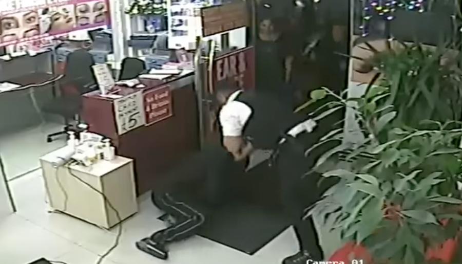 London police apprehend a would-be thief at a salon in East London, in this video posted to YouTube Nov. 17.