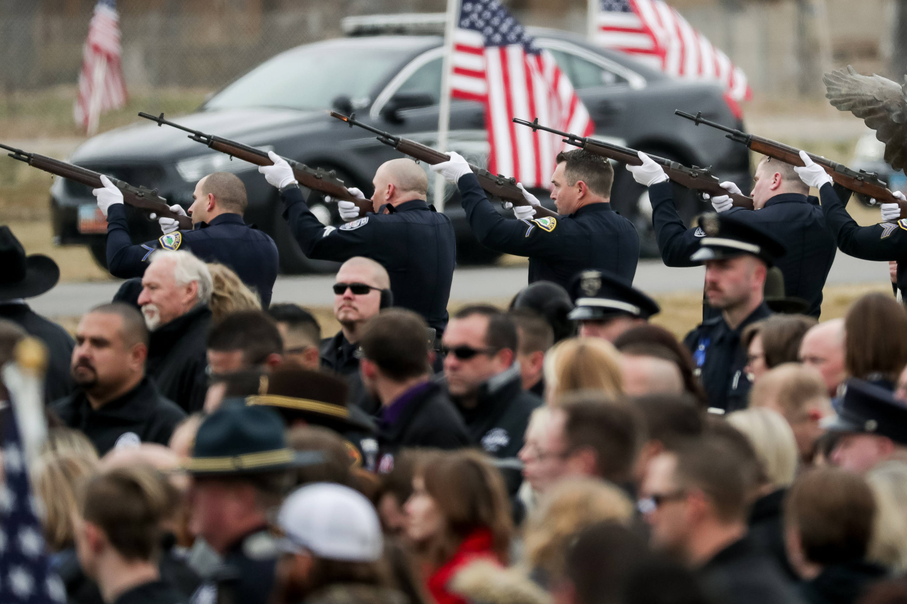 Officers fire a rifle salute during graveside services for Provo police officer Joseph Shinners in Springville on Jan. 12, 2019. After five years, attorneys are preparing for a Feb. 27 jury trial for the man accused of killing Shinners. 