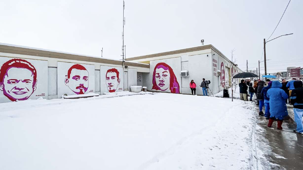 Salt Lake City leaders and some family members of people depicted on the "Fleet Block" wall gather outside of the property Wednesday afternoon. The facility is the site of a large redevelopment project in the city.