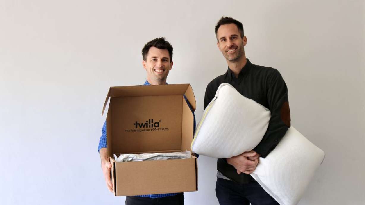 Brothers Mark Rane, left, and Peter Rane take a photo with their Pod-Pillow in St. George, Dec. 12.
