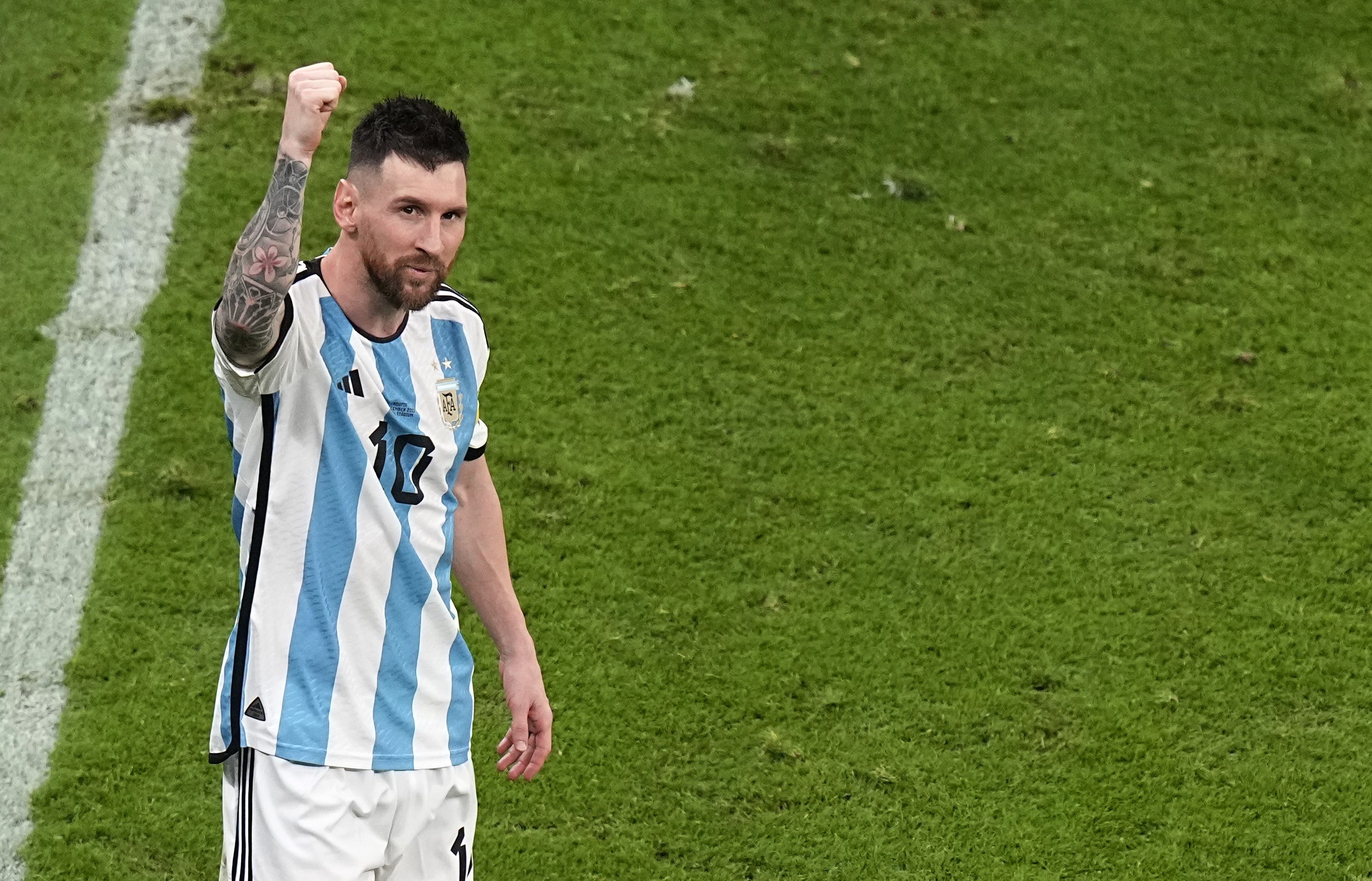 Argentina's Lionel Messi celebrates at the end of the World Cup semifinal soccer match between Argentina and Croatia at the Lusail Stadium in Lusail, Qatar, Tuesday, Dec. 13, 2022. 