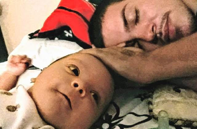 Javier Medina, pictured with his newborn son in 2016, was shot and killed while working on a car in a driveway in West Valley City. His family and police are asking for information from the public to help detectives arrest his killer.