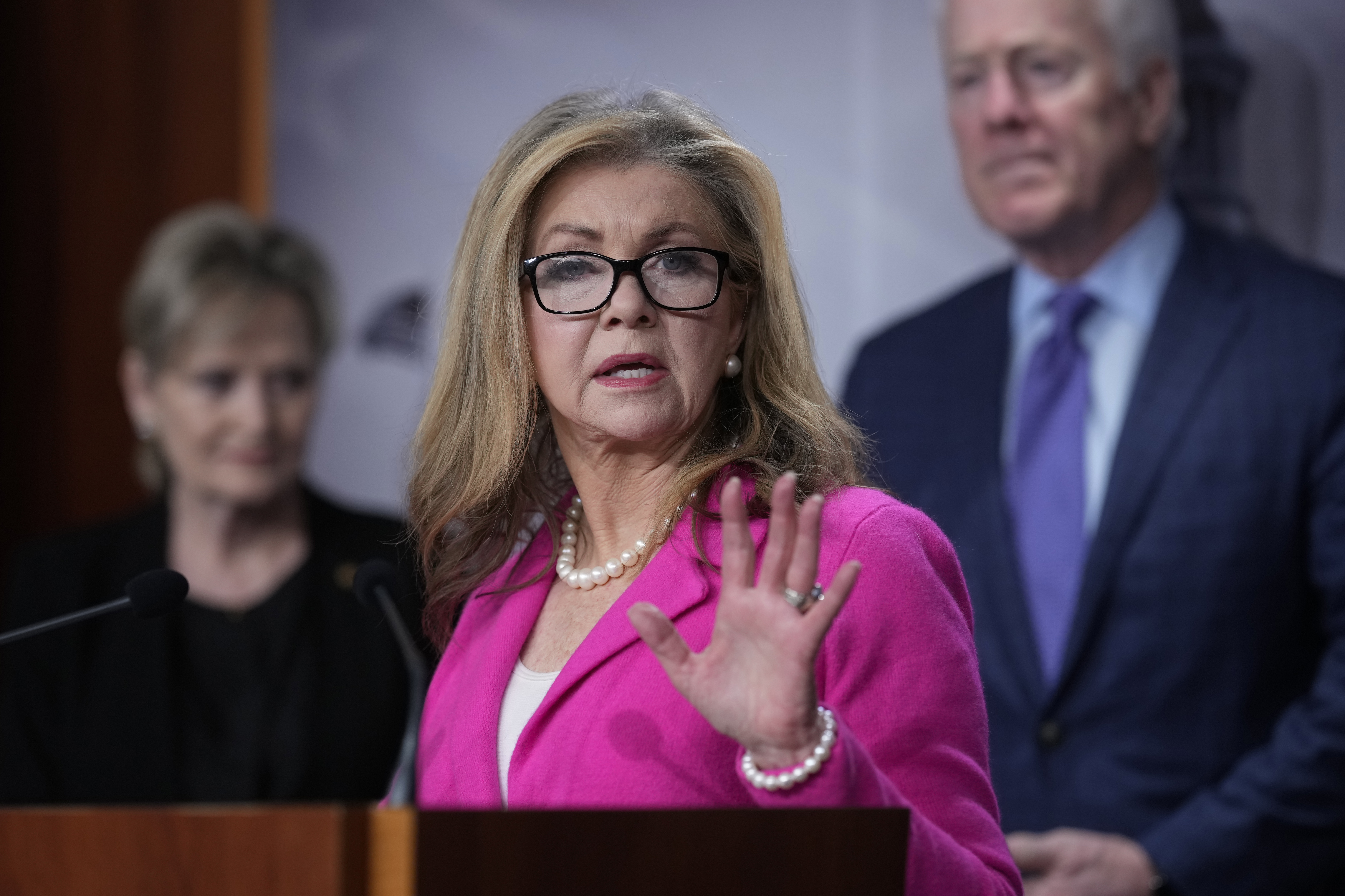 Sen. Marsha Blackburn, R-Tenn., and other Republican senators tell reporters they want the COVID-19 vaccine mandate for members of the U.S. military to be rescinded under the annual defense bill, at the Capitol in Washington, Thursday.