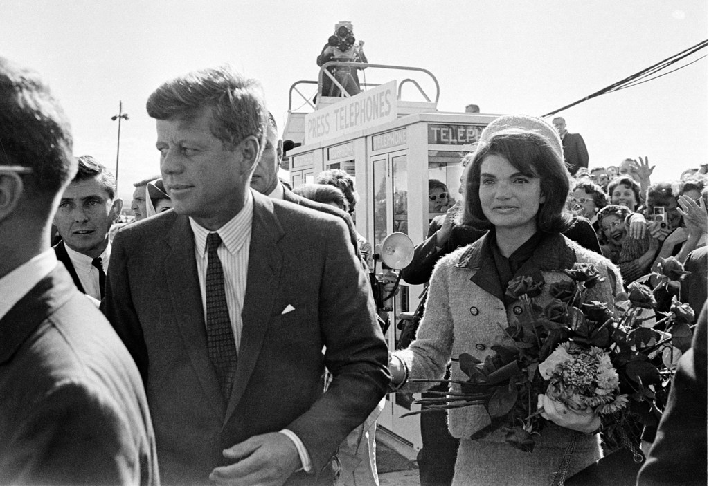 President John F. Kennedy and his wife Jacqueline Kennedy are greeted by an enthusiastic crowd upon their arrival at Dallas Love Field, on November 22, 1963. Only a few hours later the president was assassinated while riding in an open-top limousine through the city.