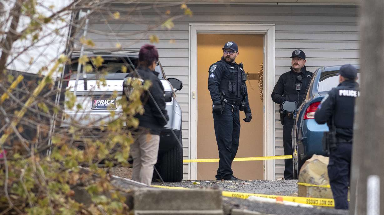 Officers investigate a homicide at an apartment complex south of the University of Idaho campus on Nov. 13. The mother of one of the four college students killed near the University of Idaho last month expressed frustration over police communications on the status of the investigation into the murders.