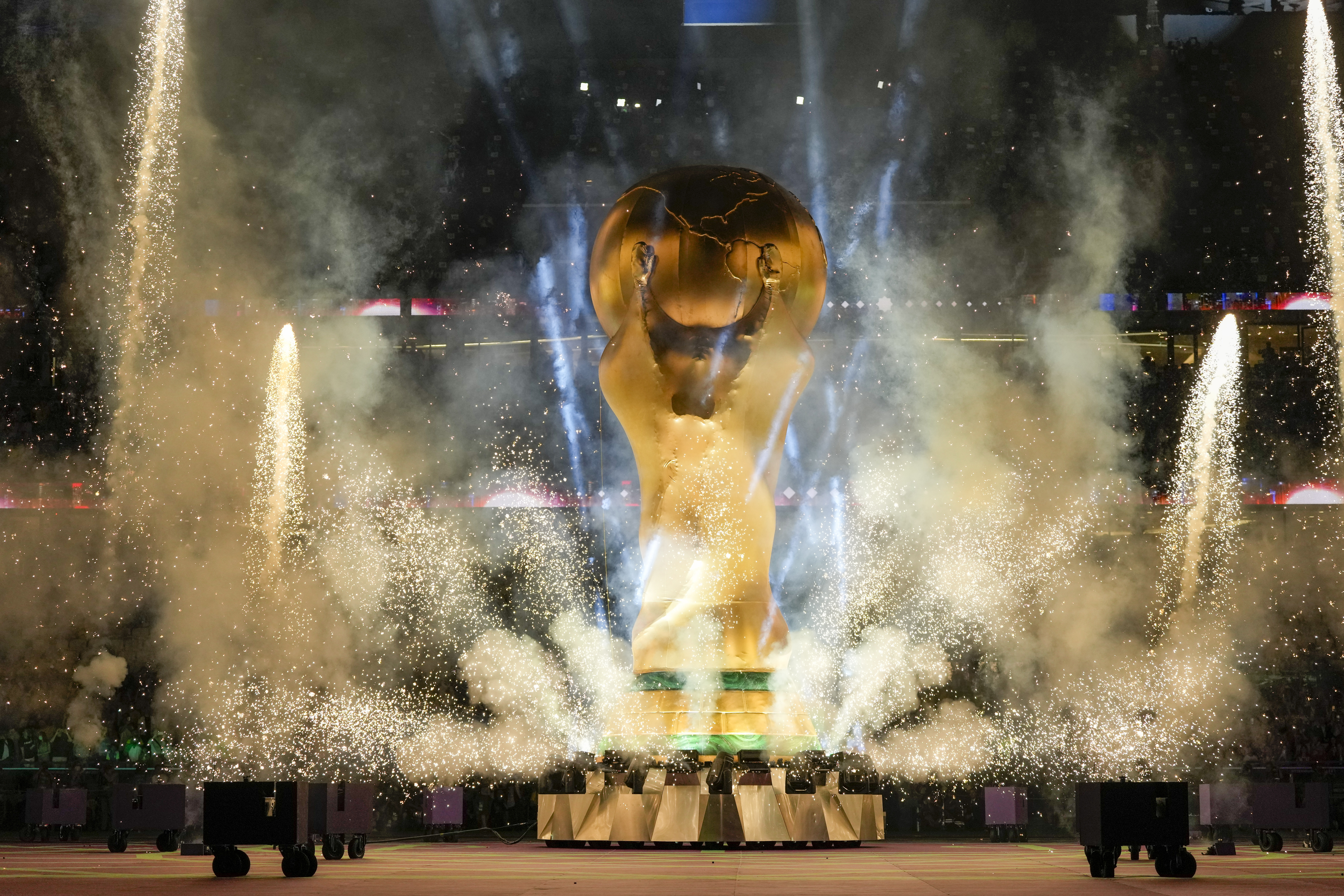 The World Cup trophy replica is shown during the opening ceremony in the World Cup quarterfinal soccer match between Croatia and Brazil, at the Education City Stadium in Al Rayyan, Qatar, Friday, Dec. 9, 2022. 