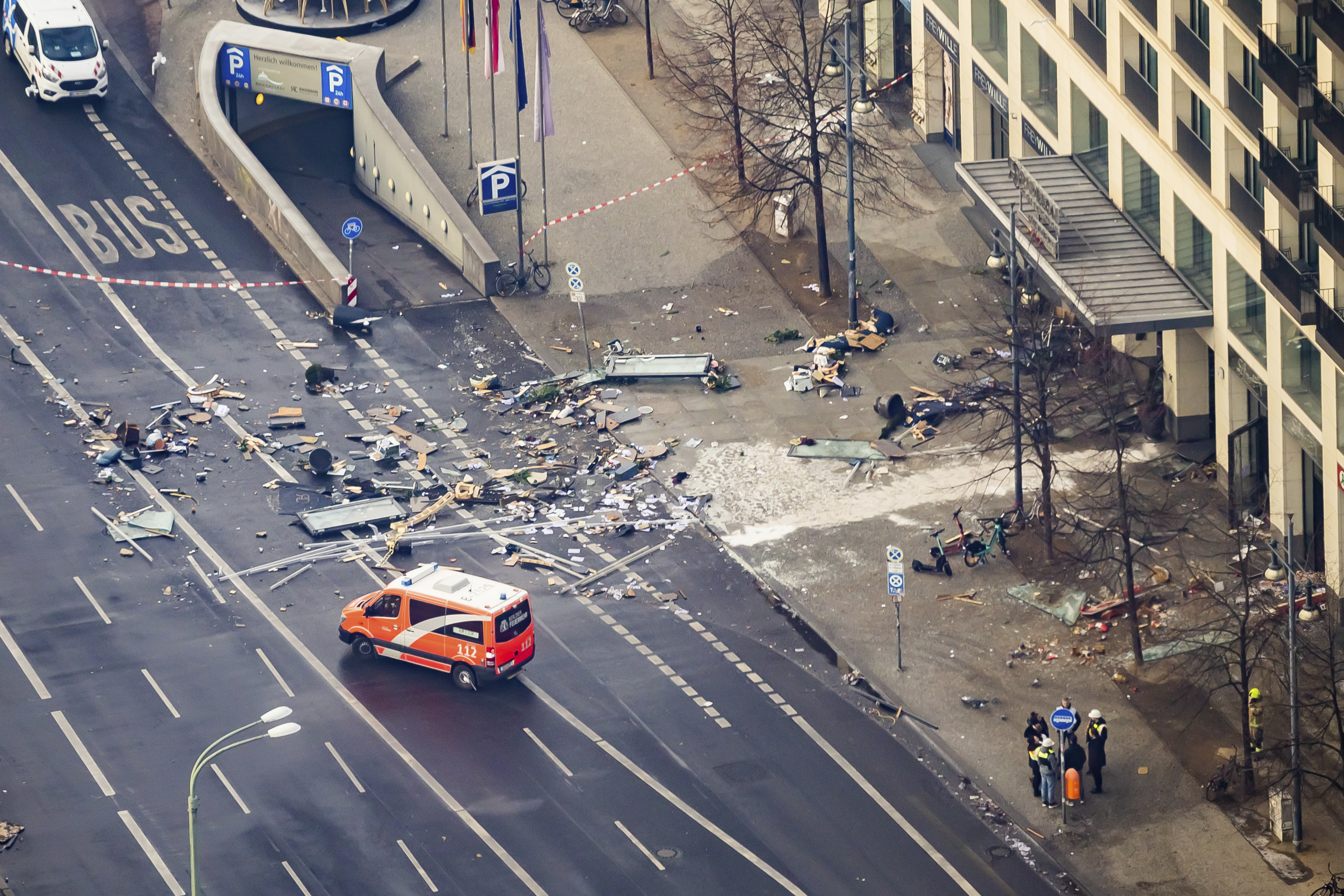 Debris lay in front of a hotel in Berlin, Germany, Friday. German police say a huge fish tank in the center of Berlin has burst.