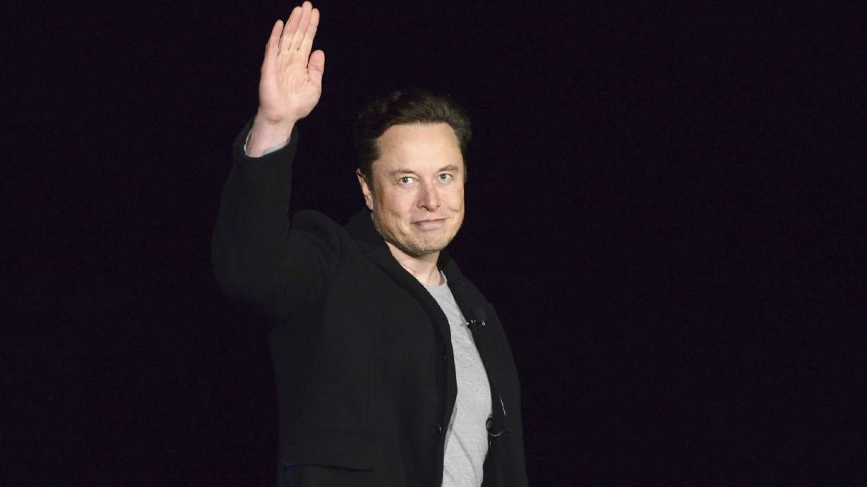 SpaceX's Elon Musk waves while providing an update on Starship, on Feb. 10, near Brownsville, Texas. Twitter on Thursday suspended the accounts of journalists who cover the social media platform and Musk.