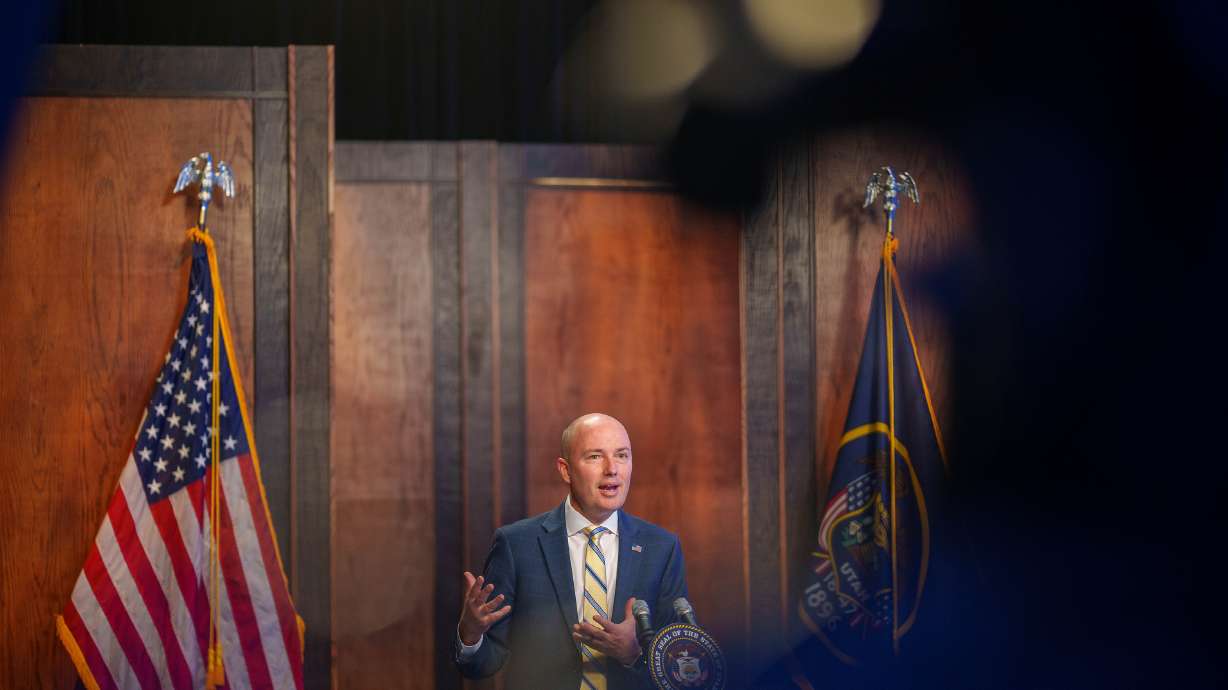 Utah Gov. Spencer Cox speaks at his monthly news conference in Salt Lake City on Thursday. Cox said that he hopes a planned I-15 expansion between Salt Lake City and Farmington won't impact homes but that families will be "compensated" if the project does.
