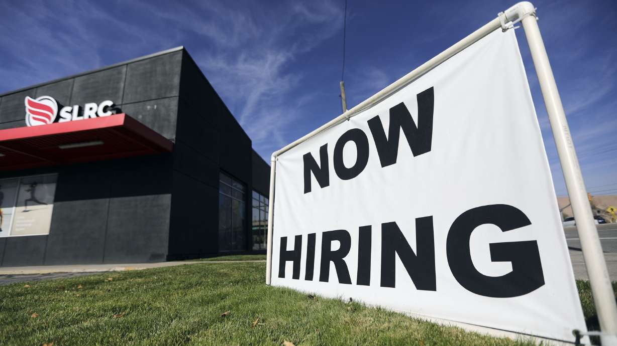 A “now hiring” sign is pictured at Salt Lake Running Company in Salt Lake City on Nov. 5, 2021. Spring not only brings warmer temperatures and vibrant colors to Utah's landscape but it also breathes life into the state's economy.