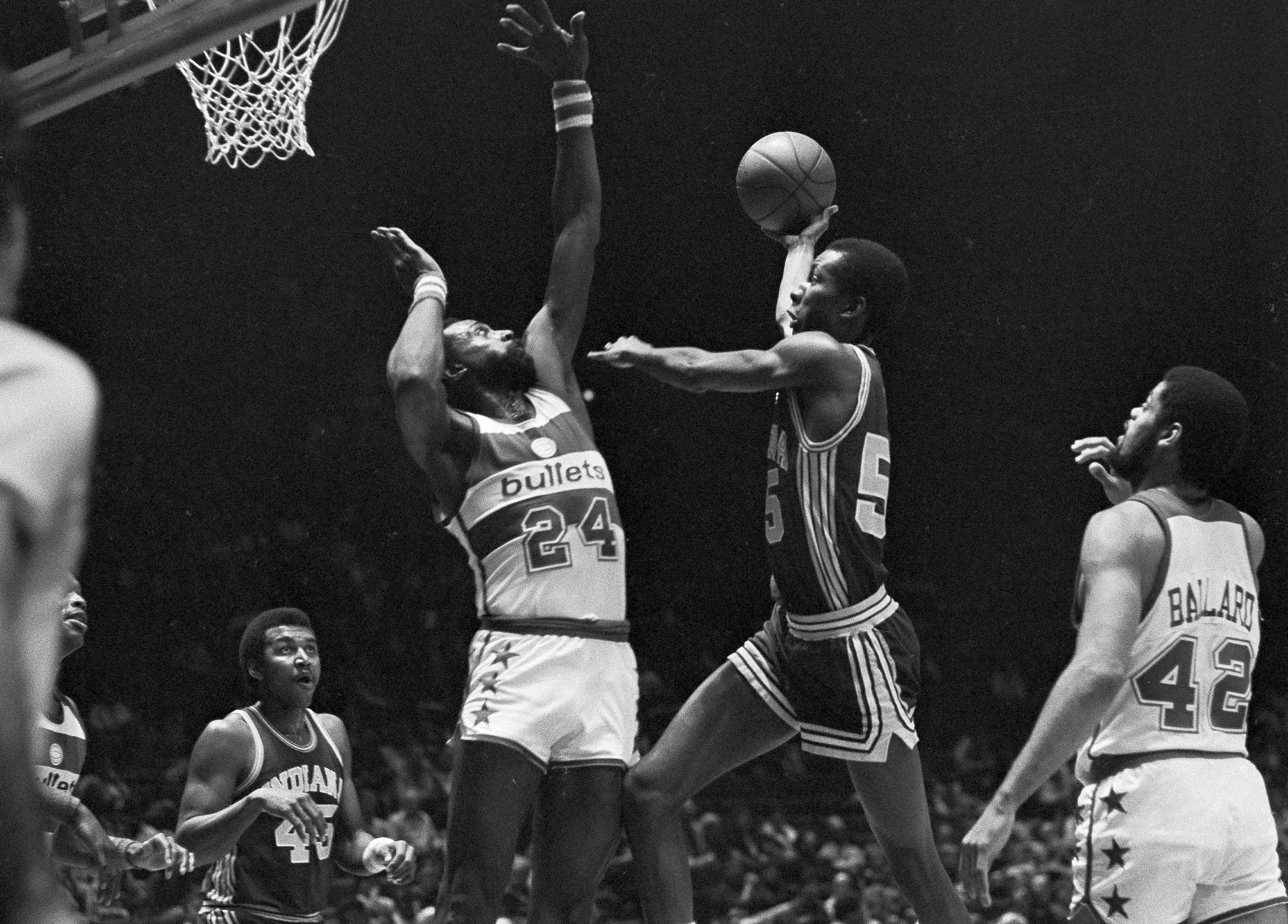 FILE - Indiana Pacers' Louis Orr drives to the basket as Washington Bullets' Spencer Haywood (24) goes for the block during second quarter action at the Capital Center in Landover, Md., Dec. 26, 1981. Haywood knocked the ball away, into the hands of teammate Greg Ballard. Louis Orr, a standout at Syracuse who played eight NBA seasons before going into a lengthy career in coaching, has died. He was 64. Orr's family said Friday in a statement through Georgetown that he died Thursday, Dec. 15, 2022, after a battle with pancreatic cancer.