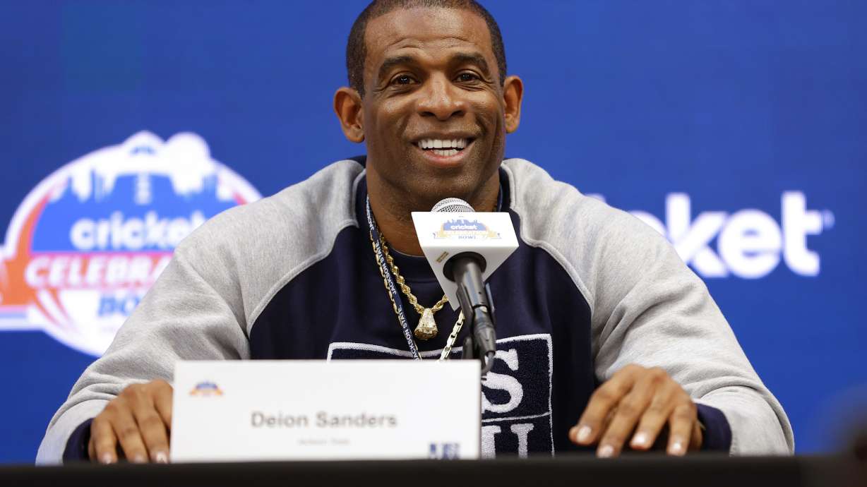 Deion Sanders speaks during a news conference for the Celebration Bowl NCAA college football game between North Carolina Central and Jackson State, Friday, Dec. 16, 2022 in Atlanta. Jackson State is looking to wrap up its first undefeated season in its final game under coach Deion Sanders, who has been hired as Colorado's coach.
